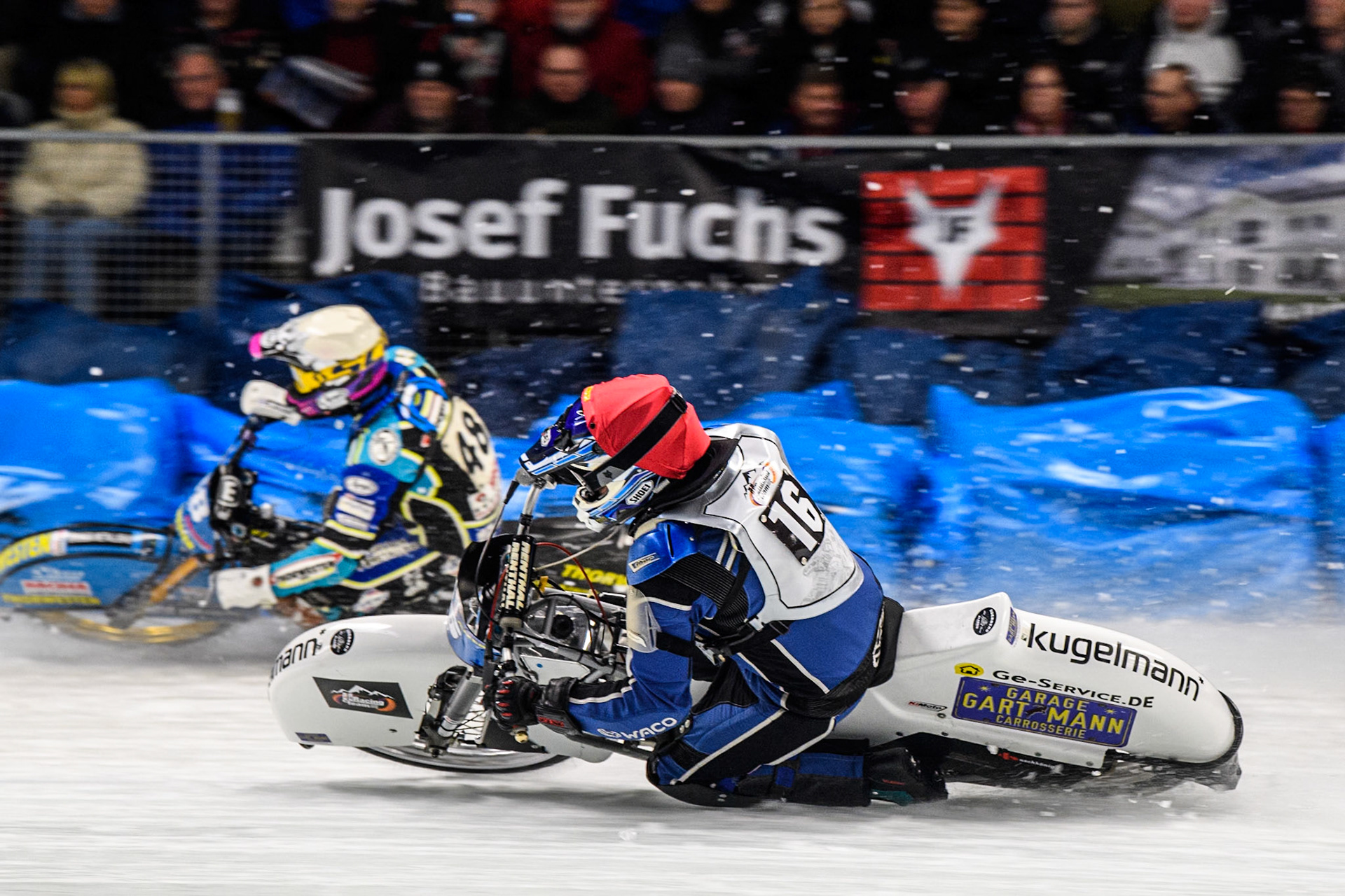 Wild Card Reinhard Greisel (16) of Germany in Red rides inside Luca Bauer (48) of Germany in White during the Ice Speedway Gladiators World Championship Final 2 at Max-Aicher-Arena, Inzell on Sunday 16th March 2025. (Photo: Ian Charles | MI News)
