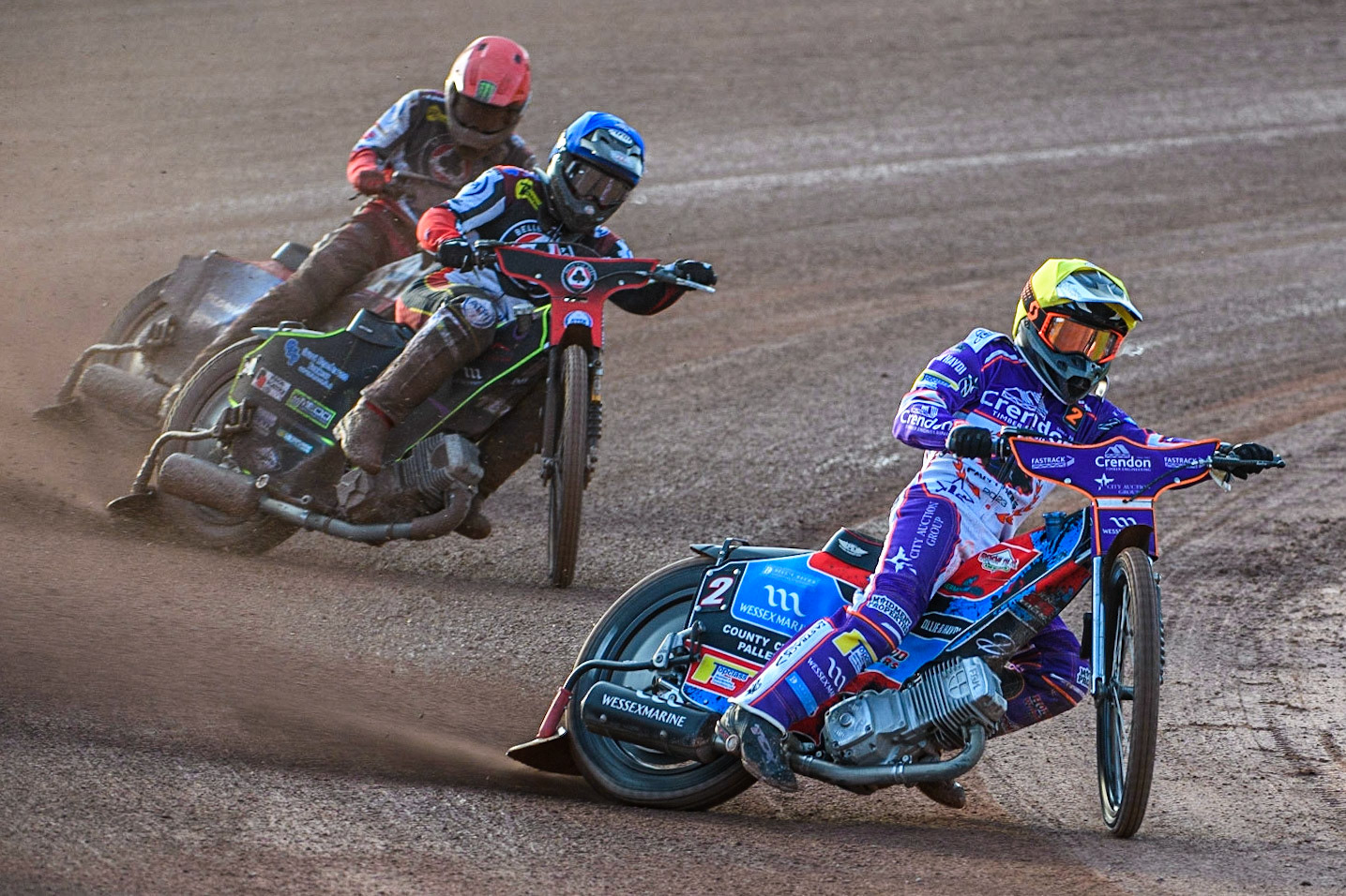 Ben Cook (Yellow) leads Tom Brennan (Blue) and Dan Bewley (Red) during the Sports Insure Premiership match between Belle Vue Aces and Peterborough at the National Speedway Stadium, Manchester on Monday 19th June 2023. (Photo: Ian Charles | MI News)