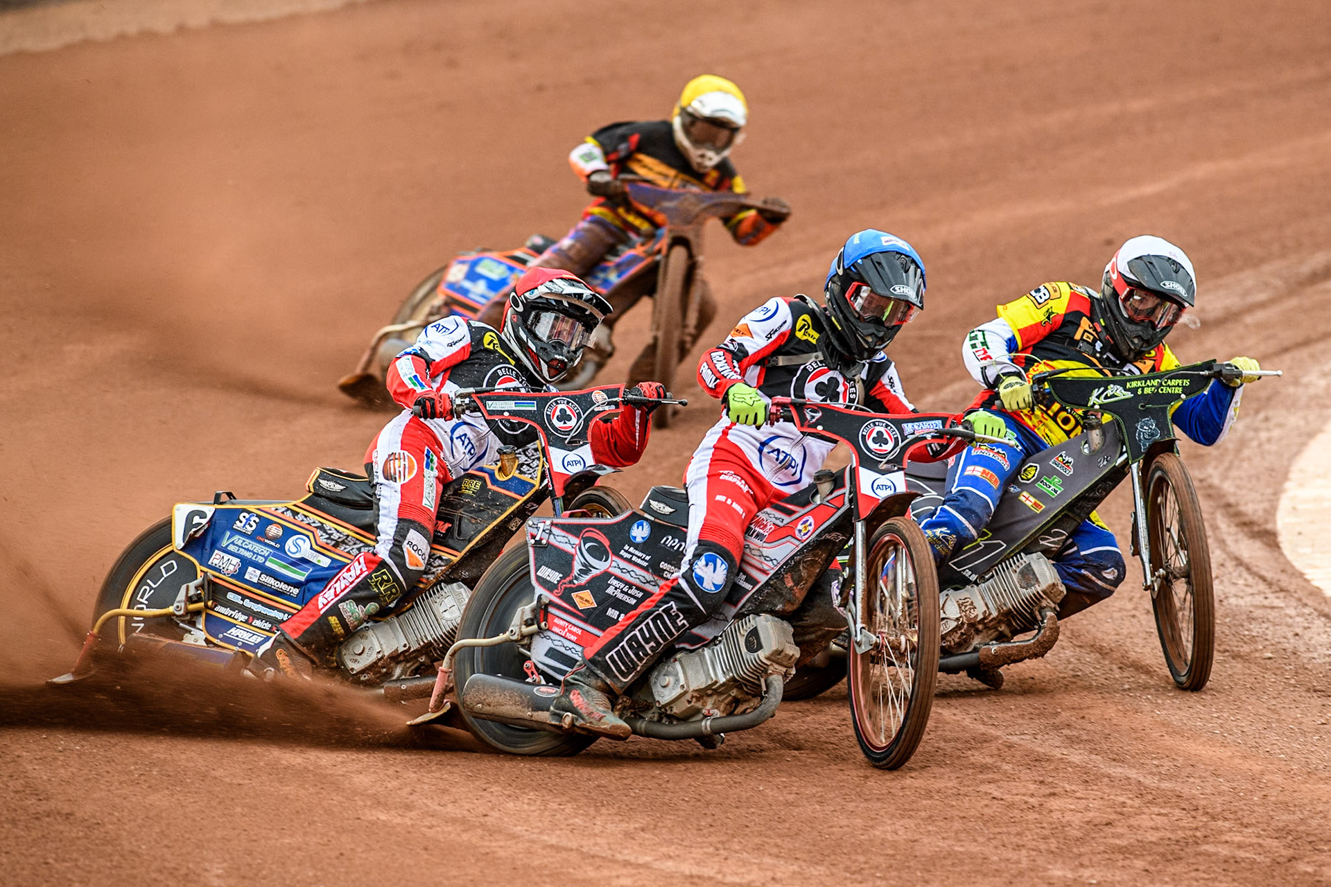 Belle Vue Aces' Connor Bailey in Blue leading Leicester Lions' Craig Cook in White, Belle Vue Aces' Connor Mountain in Red and Leicester Lions' Guest rider Luke Killeen in Yellow during the Rowe Motor Oil Premiership match between Belle Vue Aces and Leicester Lions at the National Speedway Stadium, Manchester on Monday 24th June 2024. (Photo: Ian Charles | MI News)