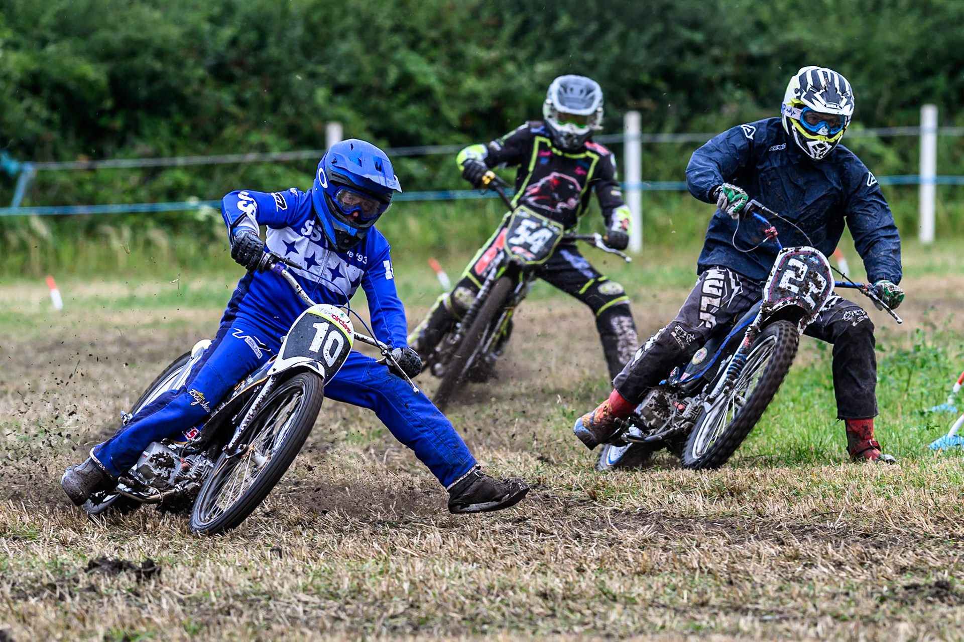 Tony Atkin (10) rides outside Phil Thomas (22) with Ian Clark (54) behind in the GT140 Class during the ACU Northern Grass Track Riders Championship at Cheshire Grass Track Club, Frog Lane, Knutsford, Cheshire on Sunday 20th July 2025. (Photo: Ian Charles | MI News)