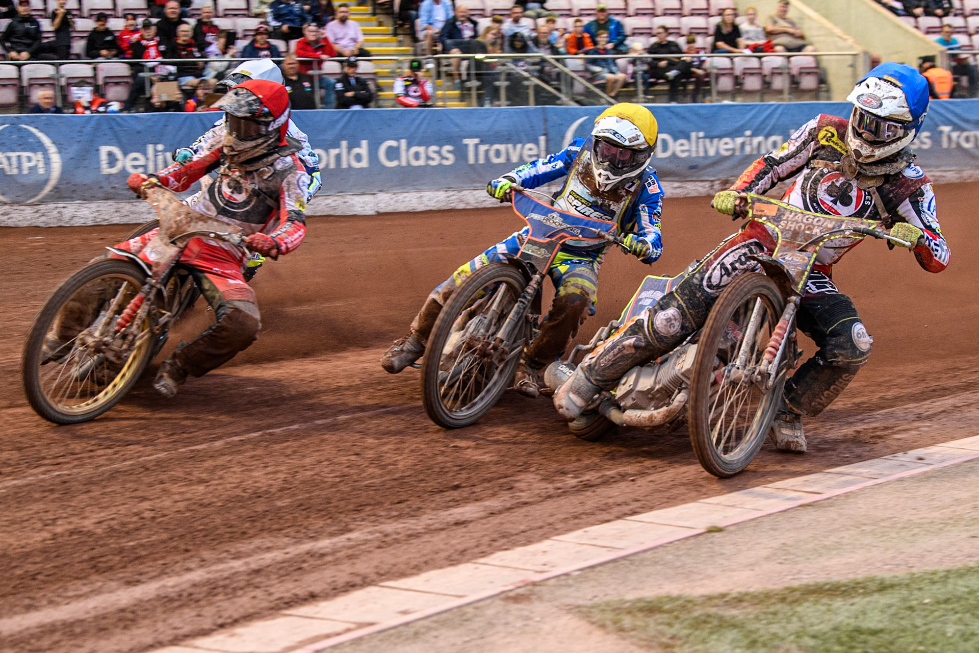 Belle Vue Aces' guest Jake Mulford  in Blue rides inside Oxford Spires' Luke Killeen  in Yellow, Belle Vue Aces' Norick Blodorn  in Red and Oxford Spires' Erik Riss  in White during the Rowe Motor Oil Premiership match between Belle Vue Aces and Oxford Spires at the National Speedway Stadium, Manchester on Monday 22nd July 2024. (Photo: Ian Charles | MI News)