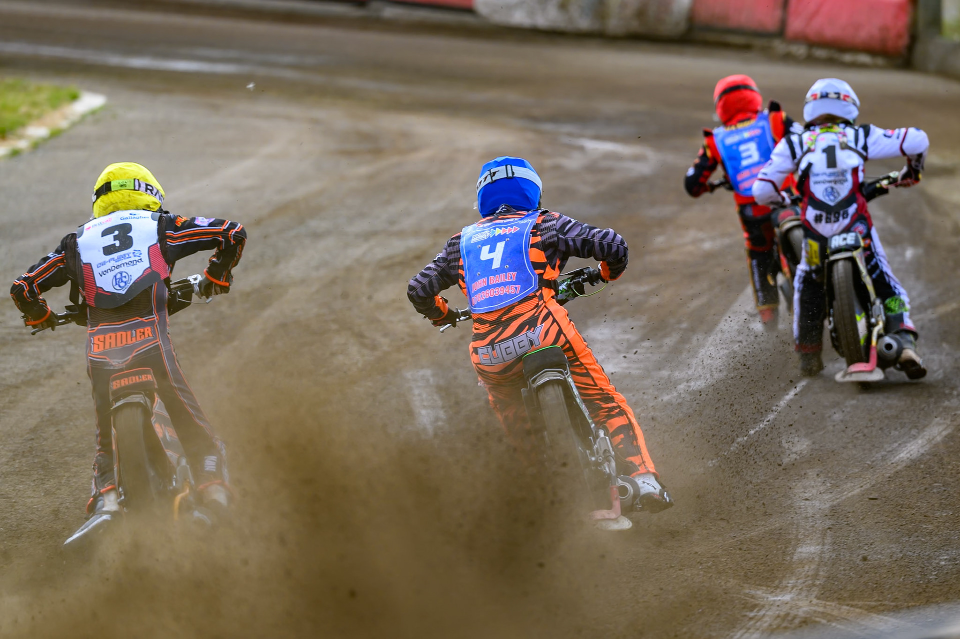 Harry Sadler of Middlesborough Tigers in Yellow chases Jack Roberts of Buxton Bulls in Blue , Ace Pijper of Middlesborough Tigers in White  and Luke Harris of Buxton Bulls in Red during the WSRA National Development League match  between Buxton Bulls and Middlesborough Tigers at Hi-Edge Speedway, Buxton on Sunday 16th August 2026. (Photo: Ian Charles | MI News)