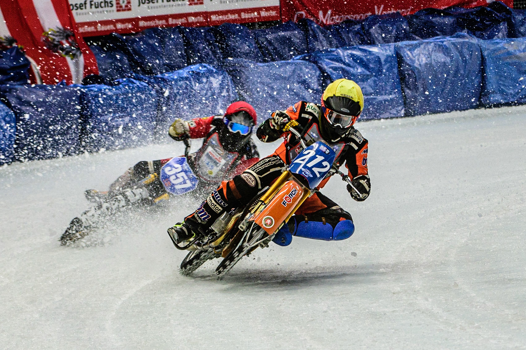 Lukas Hutla (212) (Yellow) picks up ahead of Jo Saetre (357)(Red) during the Ice Speedway Gladiators World Championship Final 1 at Max-Aicher-Arena, Inzell, Germany on Saturday 18th March 2023. (Photo: Ian Charles | MI News)