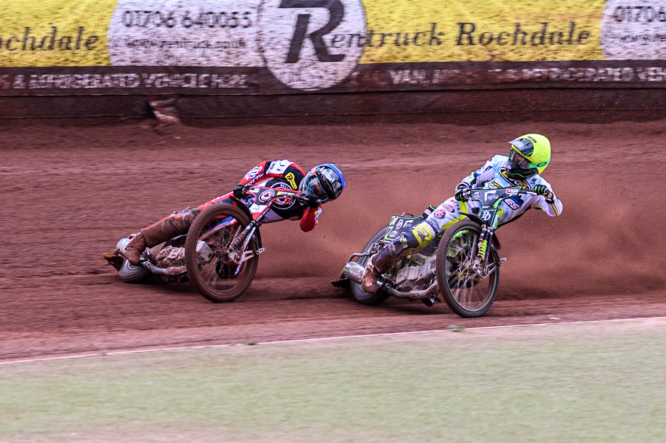 Belle Vue Aces' Ben Cook in Blue loses control after a tangle with Oxford Spires' Charles Wright in Yellow during the Rowe Motor Oil Premiership match between Belle Vue Aces and Oxford Spires at the National Speedway Stadium, Manchester on Monday 22nd July 2024. (Photo: Ian Charles | MI News)