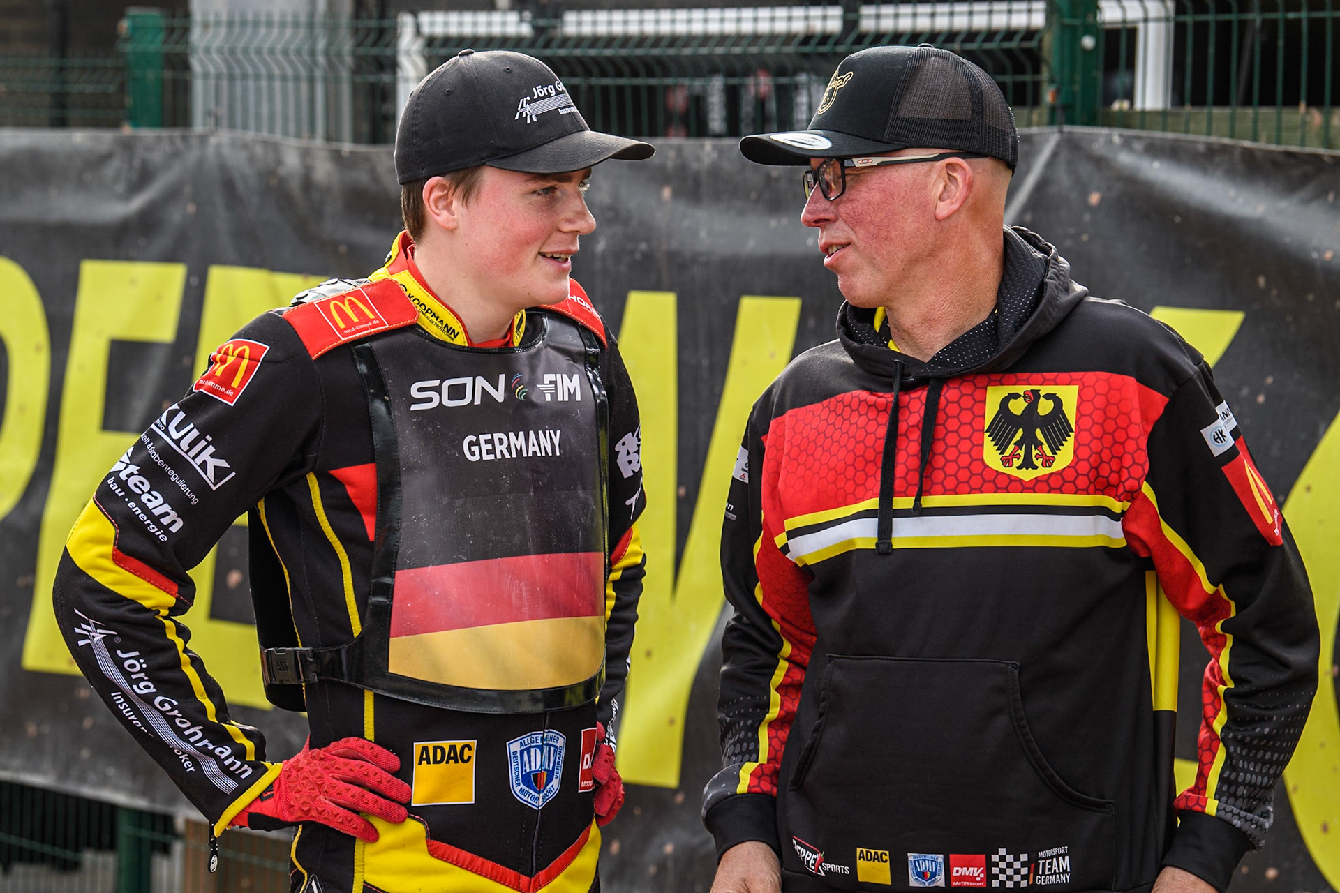 Norick Blödorn of Germany (Left) chats with his mechanic during the Monster Energy FIM Speedway of Nation Final at the National Speedway Stadium, Manchester on Saturday 13th July 2024. (Photo: Ian Charles | MI News)