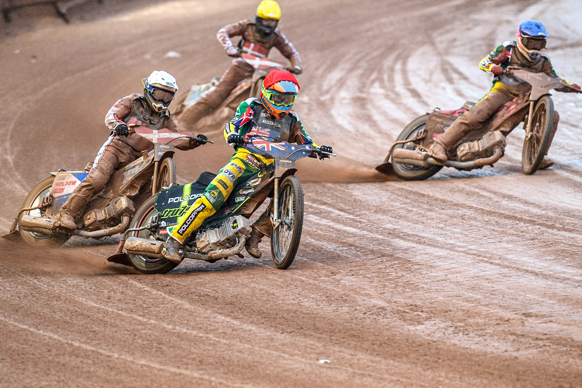 Keynan Rew of Australia in Red leading Bastian Pedersen of Denmark in White, James Pearson of Australia in Blue  and Jesper Knudsen of Denmark in Yellow during the Monster Energy FIM Speedway of Nations 2 (Under 21) Final at the National Speedway Stadium, Manchester on Friday 12th July 2024. (Photo: Ian Charles | MI News)