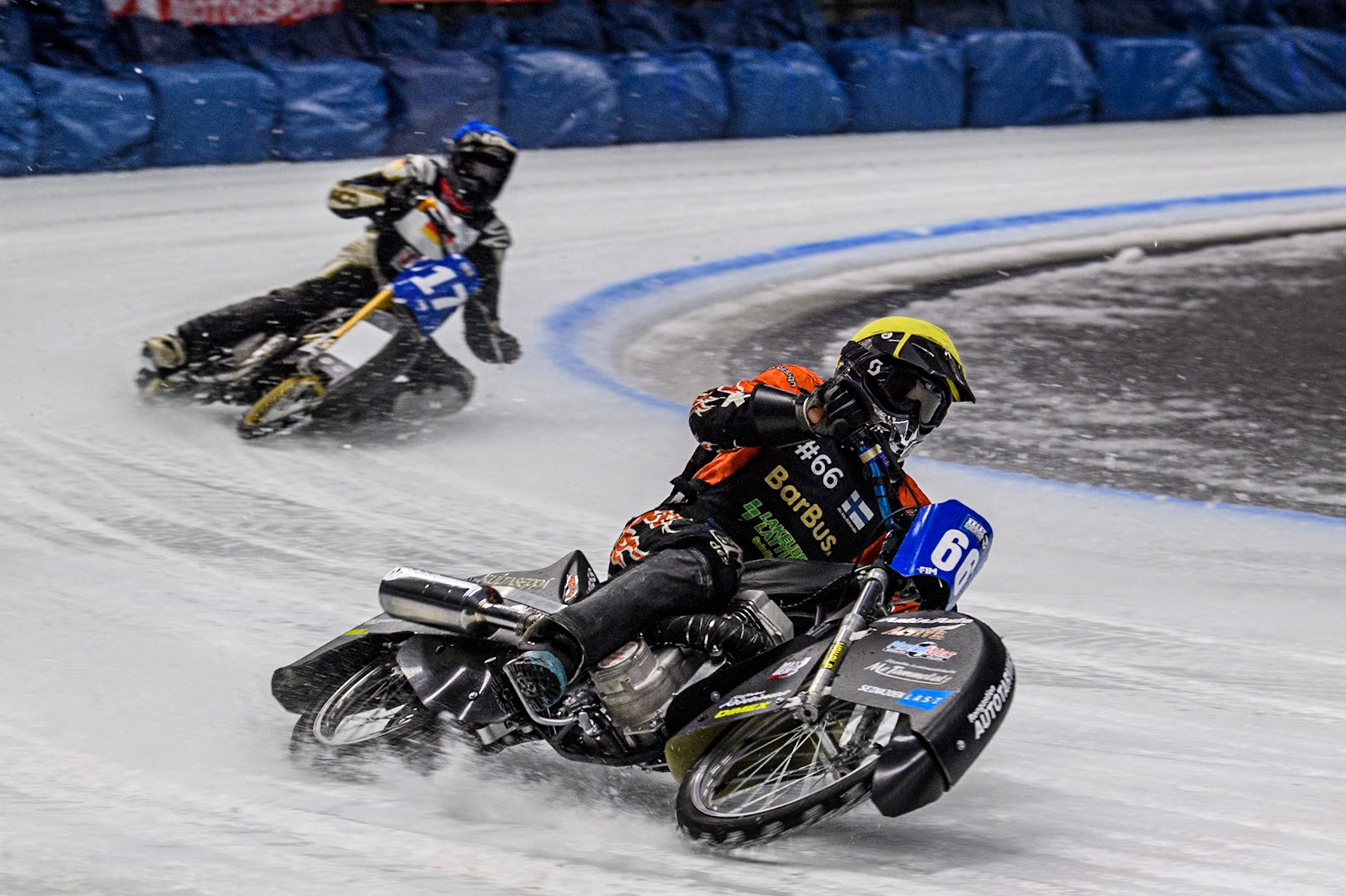 Finland's Aki Ala-Riihimäki (66) (Yellow) leads  Germany's Franz Mayerbüchler (17) (Blue) during the FIM Ice Speedway Gladiators World Championship Final 1 at the Max-Aicher-Arena, Inzell on Saturday 23 March 2024. (Photo: Ian Charles | MI News)