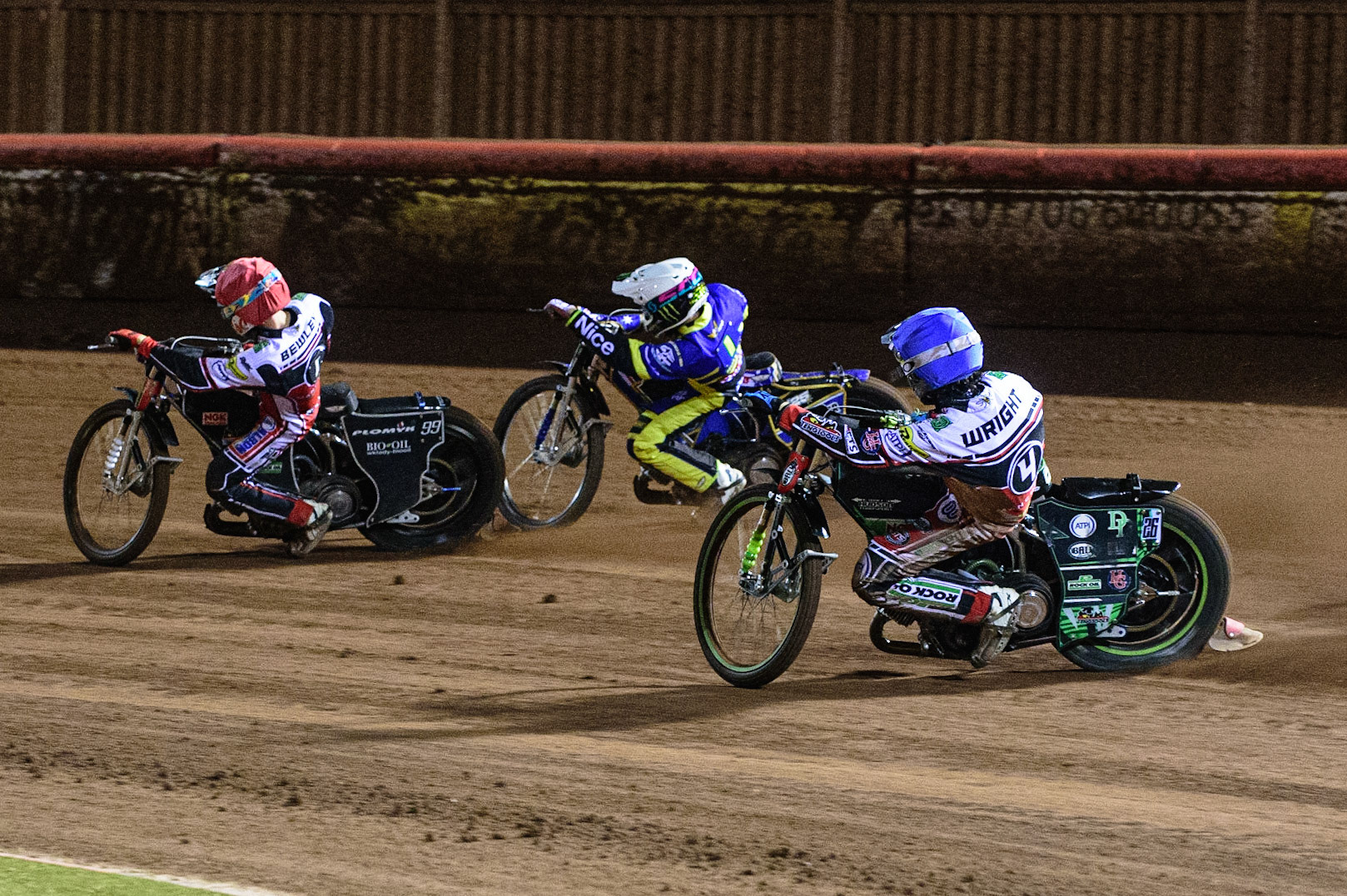 MANCHESTER, UK. OCT 7TH  Charles Wright  (Blue) chases Jack Holder  (White) and Dan Bewley  (Red) during the SGB Premiership Play off Semi-Final Second Leg between Belle Vue Aces and Sheffield Tigers at the National Speedway Stadium, Manchester on Thursday 7th October 2021. (Credit: Ian Charles | MI News)