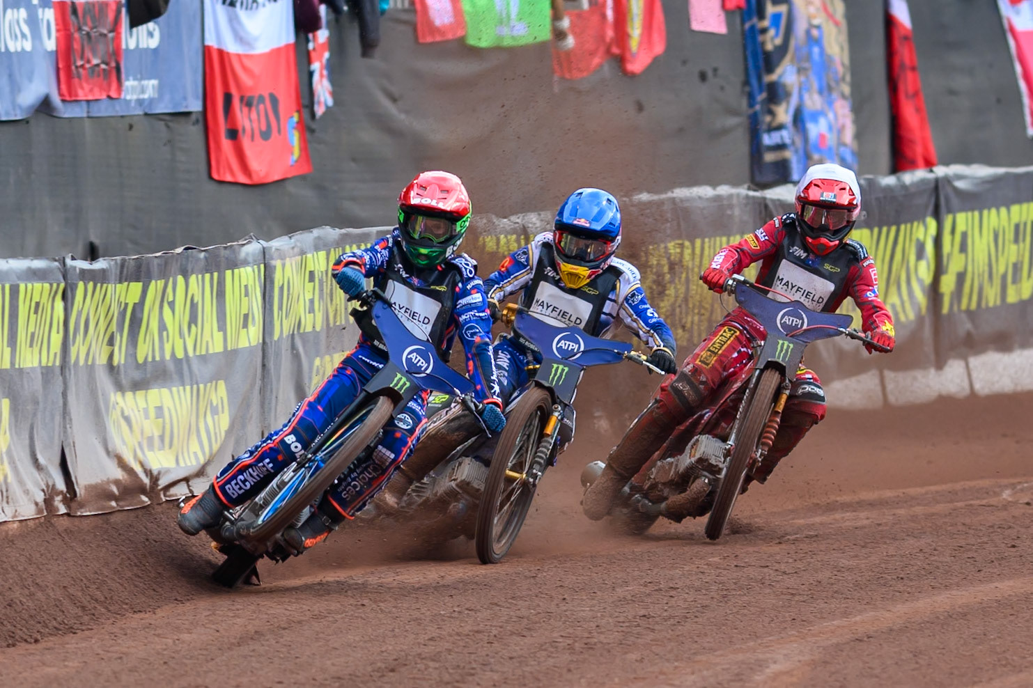 Brady Kurtz (101) of Australia in Red picks up some drive leading Robert Lambert (505) of Great Britain in Blue and Max Fricke (46) of Australia in White during the ATPI  FIM Speedway GP of Manchester at the National Speedway Stadium, Manchester on Saturday 6th June 2026. (Photo: Ian Charles | MI News)
