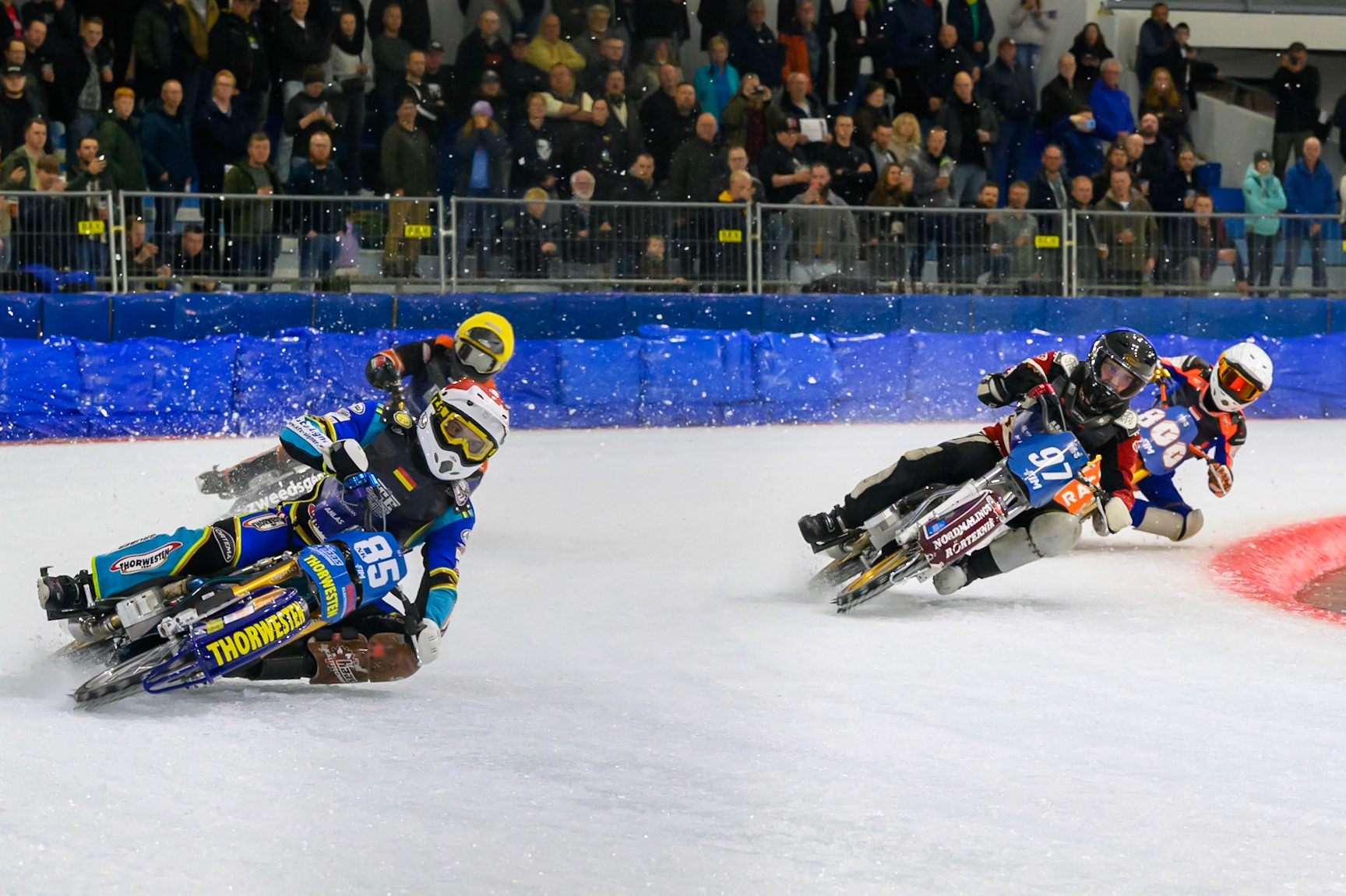 Luca Bauer (85) of Italy/Germany in Red leading Ove Ledström (97) of Sweden  in Blue, Sebastian Reitsma (125) of The Netherlands in Yellow and Jasper Iwema (800) of The Netherlands in White during the FIM Ice Speedway Gladiators World Championship Final 3 at Ice Rink Thialf, Heerenveen on Saturday 11th April 2026. (Photo: Ian Charles | MI News)