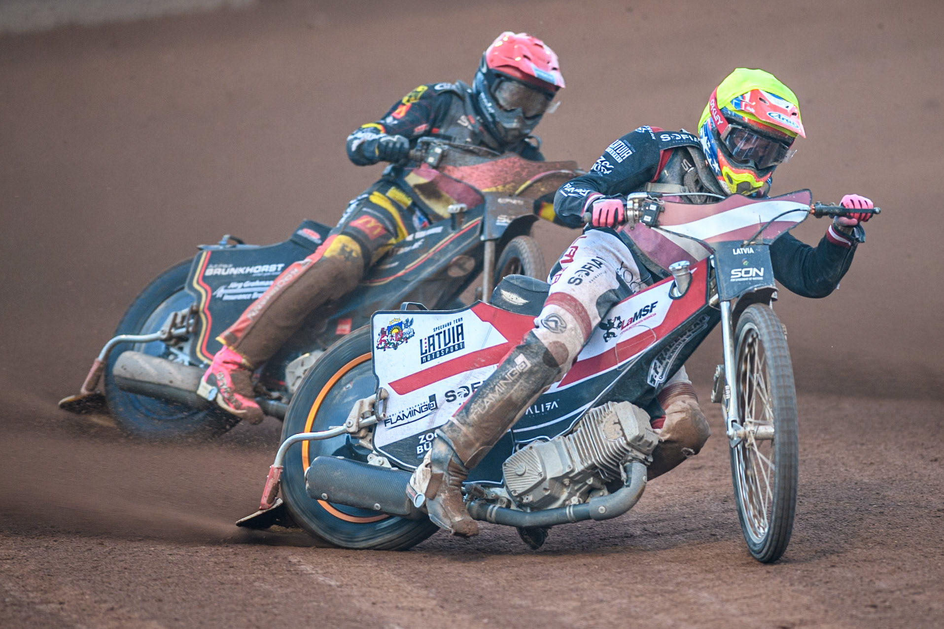 Daniils Kolodinskis of Latvia in Yellow leading Kai Huckenbeck of Germany in Red during the Monster Energy FIM Speedway of Nation Final at the National Speedway Stadium, Manchester on Saturday 13th July 2024. (Photo: Ian Charles | MI News)