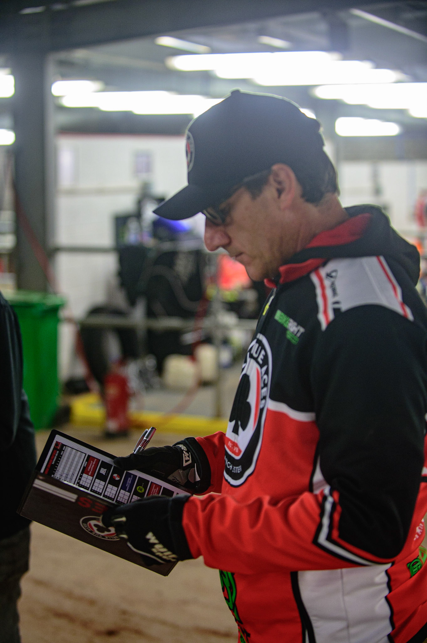 MANCHESTER, UK. OCT 11TH  Mark Lemon  checks his programme during the SGB Premiership Grand Final 1st Leg between Belle Vue Aces and Peterborough Panthers at the National Speedway Stadium, Manchester on Monday 11th October 2021. (Credit: Ian Charles | MI News)