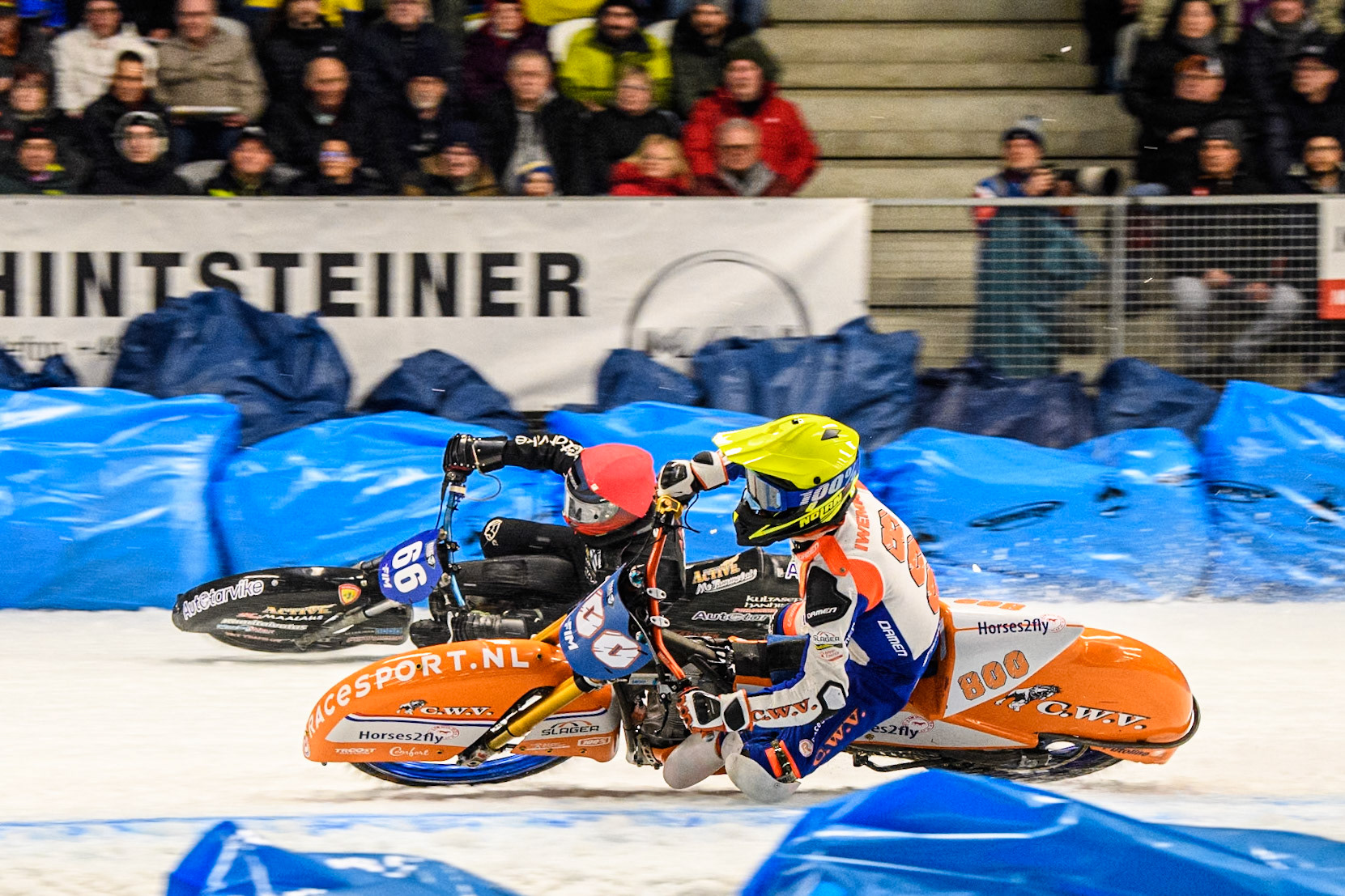 Jasper Iwema (800) of The Netherlands in Yellow rides inside Aki Ala-Riihimäki (66) of Finland in Red during the Ice Speedway Gladiators World Championship Final 2 at Max-Aicher-Arena, Inzell on Sunday 16th March 2025. (Photo: Ian Charles | MI News)