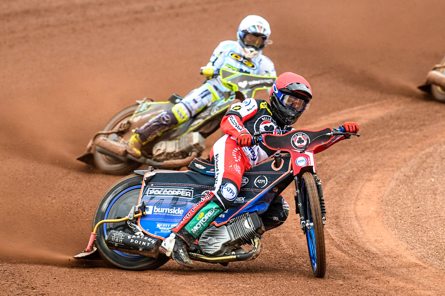 Belle Vue Aces' Brady Kurtz in Red leading Oxford Spires' Rohan Tungate in White during the Rowe Motor Oil Premiership match between Belle Vue Aces and Oxford Spires at the National Speedway Stadium, Manchester on Monday 22nd July 2024. (Photo: Ian Charles | MI News)