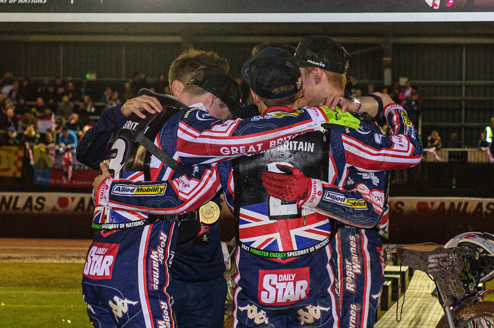 MANCHESTER, UK. OCT 17TH Group hug for Team GB on the Rostrum during the Monster Energy FIM Speedway of Nations at the National Speedway Stadium, Manchester on Sunday  17th October 2021. (Credit: Ian Charles | MI News)
