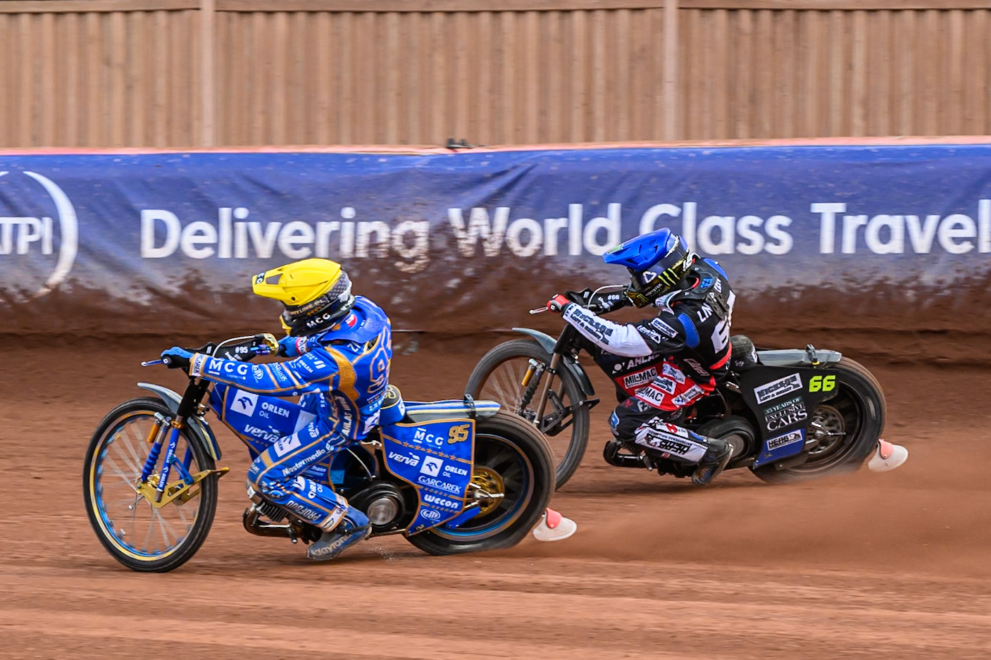 Bartosz Zmarzlik (95) of Poland in Yellow rides inside Fredrik Lindgren (66) of Sweden in Blue during the ATPI FIM Speedway Grand Prix Round 4 at the National Speedway Stadium, Manchester, on Friday 13th June 2025. (Photo: Ian Charles | MI News)