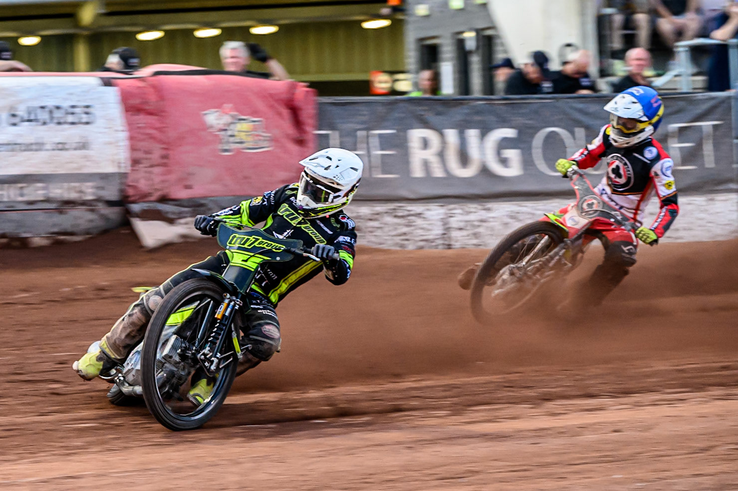 Ipswich Witches' Tom Brennan  in White leading Belle Vue Aces' Tate Zischke  in Blue during the Rowe Motor Oil Premiership match between Belle Vue Aces and Ipswich Witches at the National Speedway Stadium, Manchester on Monday 30th June 2025. (Photo: Ian Charles | MI News)