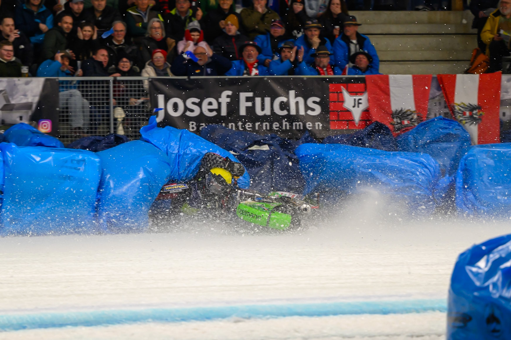 Johann Weber (33) of Germany  spins off behind Heikki Huusko (67) of Finland in Blue during the Ice Speedway Gladiators World Championship Final 1 at Max-Aicher-Arena, Inzell on Saturday 14th March 2026. (Photo: Ian Charles | MI News)