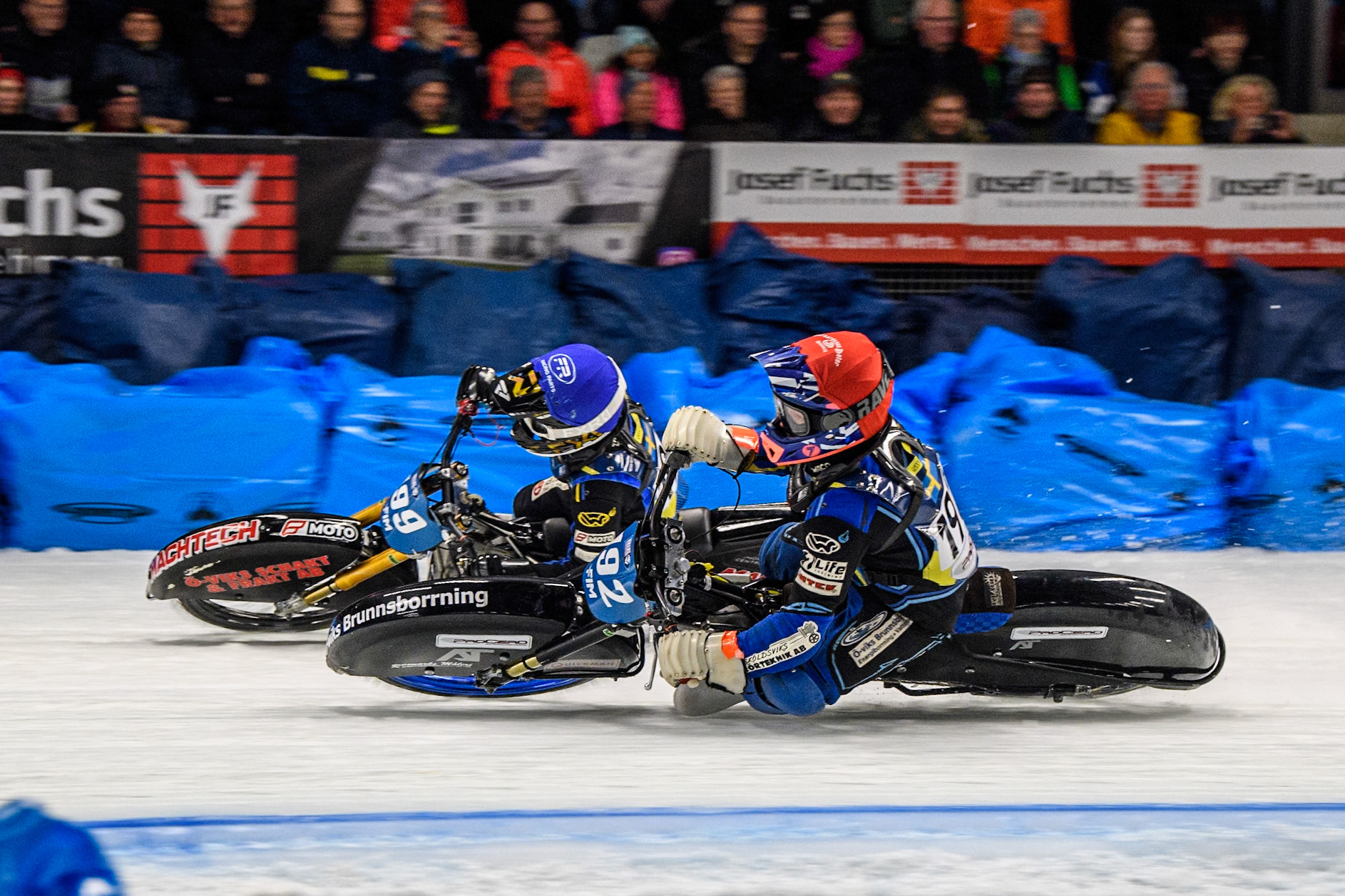Niclas Svensson (192) of Sweden rides inside Martin Haarahiltunen (199) of Sweden in Blue during the Ice Speedway Gladiators World Championship Final 1 at Max-Aicher-Arena, Inzell on Saturday 15th March 2025. (Photo: Ian Charles | MI News)