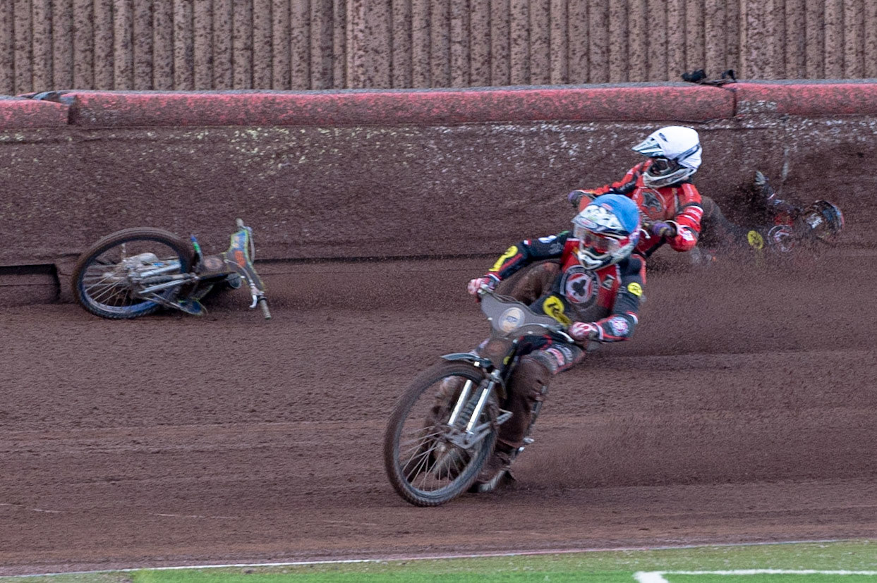 Photo by Ian Charles:

Dan Bewley  (Red) falls after clashing with Rohan Tungate (White) with Steve Worrall  leading

Belle Vue Aces v Peterborough Panthers, British Speedway Premiership, National Speedway Stadium, Manchester, Thursday, 13, June, 2019