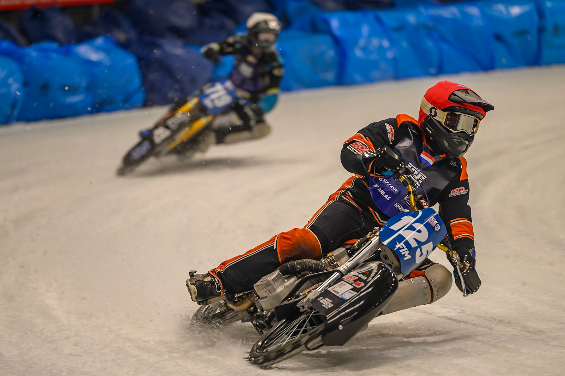 Sebastian Reitsma (125) of The Netherlands in Red leading Filip Jäger (719) of Sweden  in White during the Ice Speedway Gladiators World Championship Final 1 at Max-Aicher-Arena, Inzell on Saturday 14th March 2026. (Photo: Ian Charles | MI News)