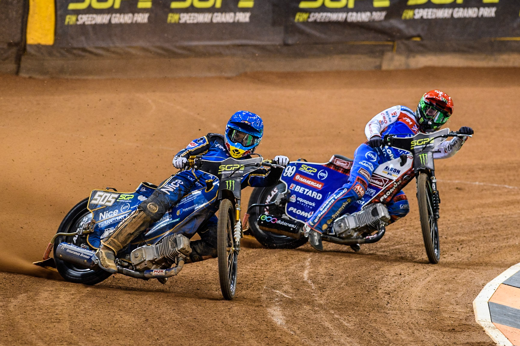 Robert Lambert (505) of Great Britain in Blue leading Daniel Bewley (99) of Great Britain in Red during the FIM Speedway Grand Prix of Great Britain at The Principality Stadium, Cardiff on Saturday 17th August 2024. (Photo: Ian Charles | MI News)