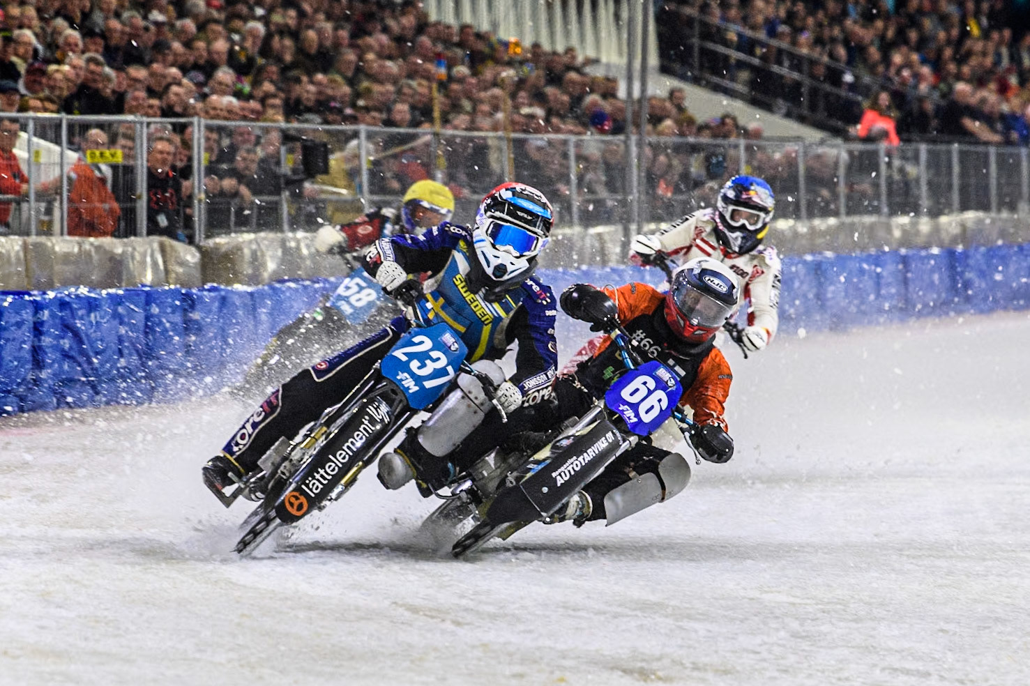 Sweden's Jimmy Hörnell Lidfalk (237) in Red and Finland's Aki Ala-Riihimäki (66) in White get up close ahead of Austria's Franz Zorn (100) in Blue and Sweden's Stefan Svensson (58) in Yellow during the FIM Ice Speedway Gladiators World Championship Final 3 at Ice Rink Thialf, Heerenveen on Saturday 6th April 2024. (Photo: Ian Charles | MI News)
