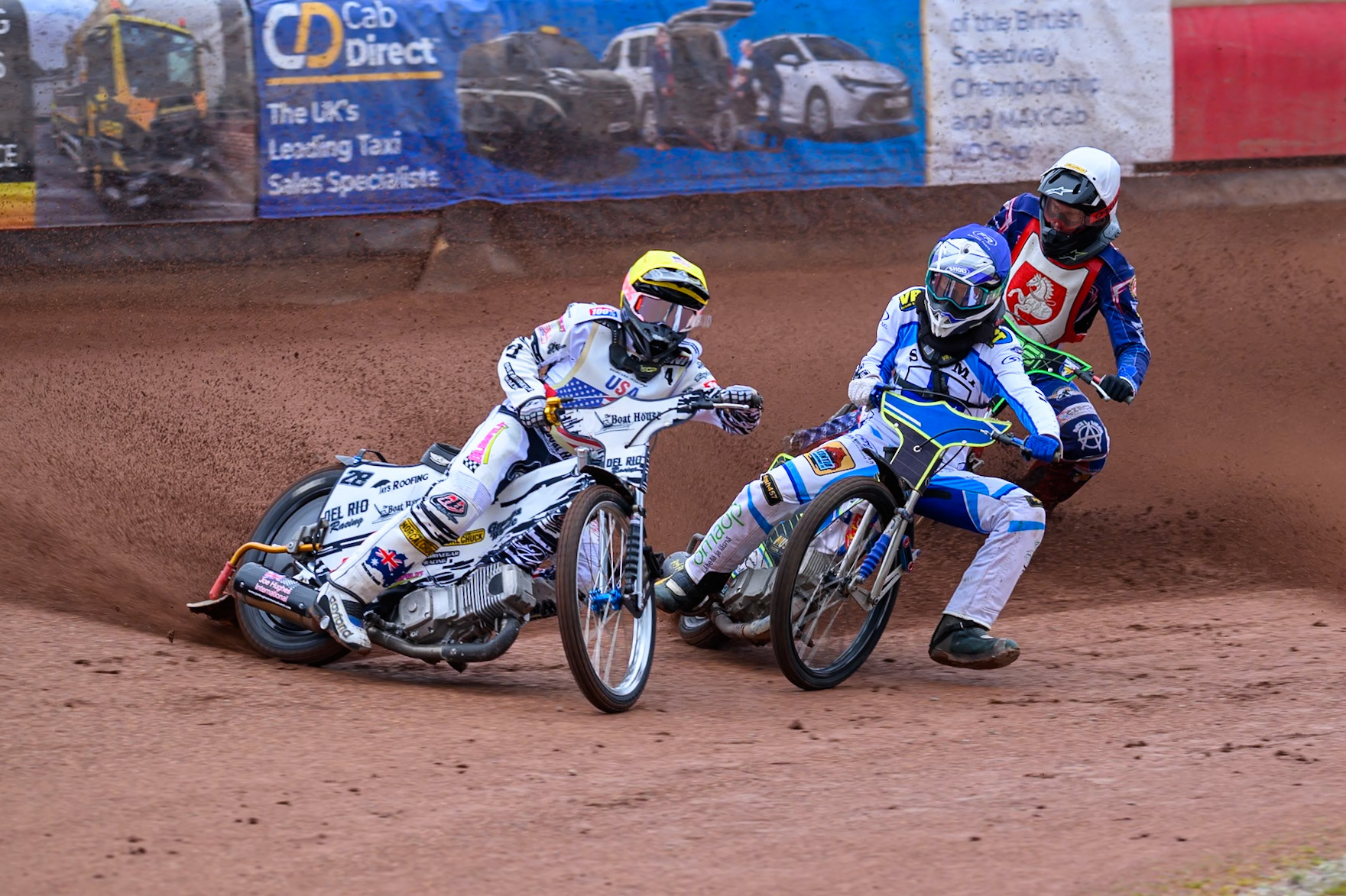 Slater Lightcap of The United States in Red leading Otto Raak of Finland in Blue with Jan Jenicek of Czechia in White behind during the FIM SGP2 Qualifying Round at the Peugeot Ashfield Stadium in Glasgow on Saturday 24th May 2025. (Photo: Ian Charles | MI News)