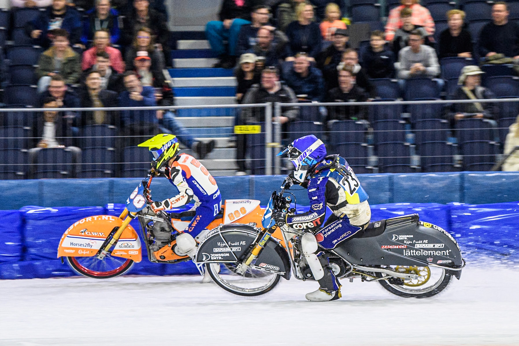 Jasper Iwema (800) of The Netherlands in Yellow passes Jimmy Hörnell (237) of Sweden in Blue during the FIM Ice Speedway Gladiators World Championship, Final 3 at the Ice Stadium, Thialf, Heerenveen on Saturday 5th April 2025. (Photo: Ian Charles | MI News)