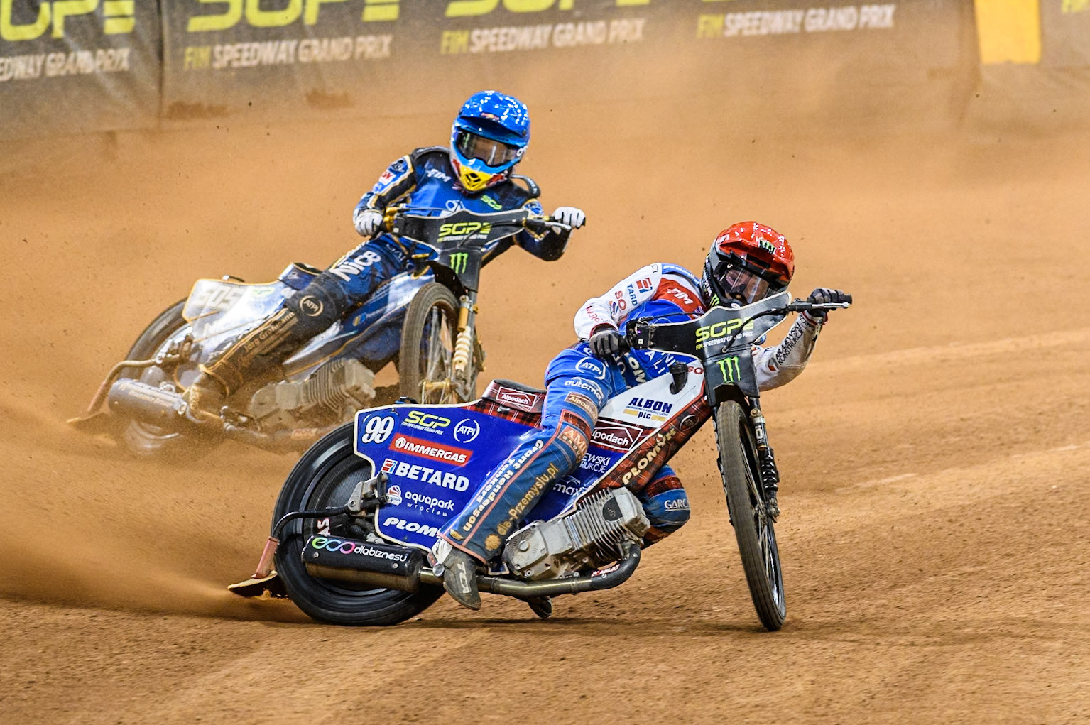 Daniel Bewley (99) of Great Britain in Red leading Robert Lambert (505) of Great Britain in Blue during the FIM Speedway Grand Prix of Great Britain at The Principality Stadium, Cardiff on Saturday 17th August 2024. (Photo: Ian Charles | MI News)