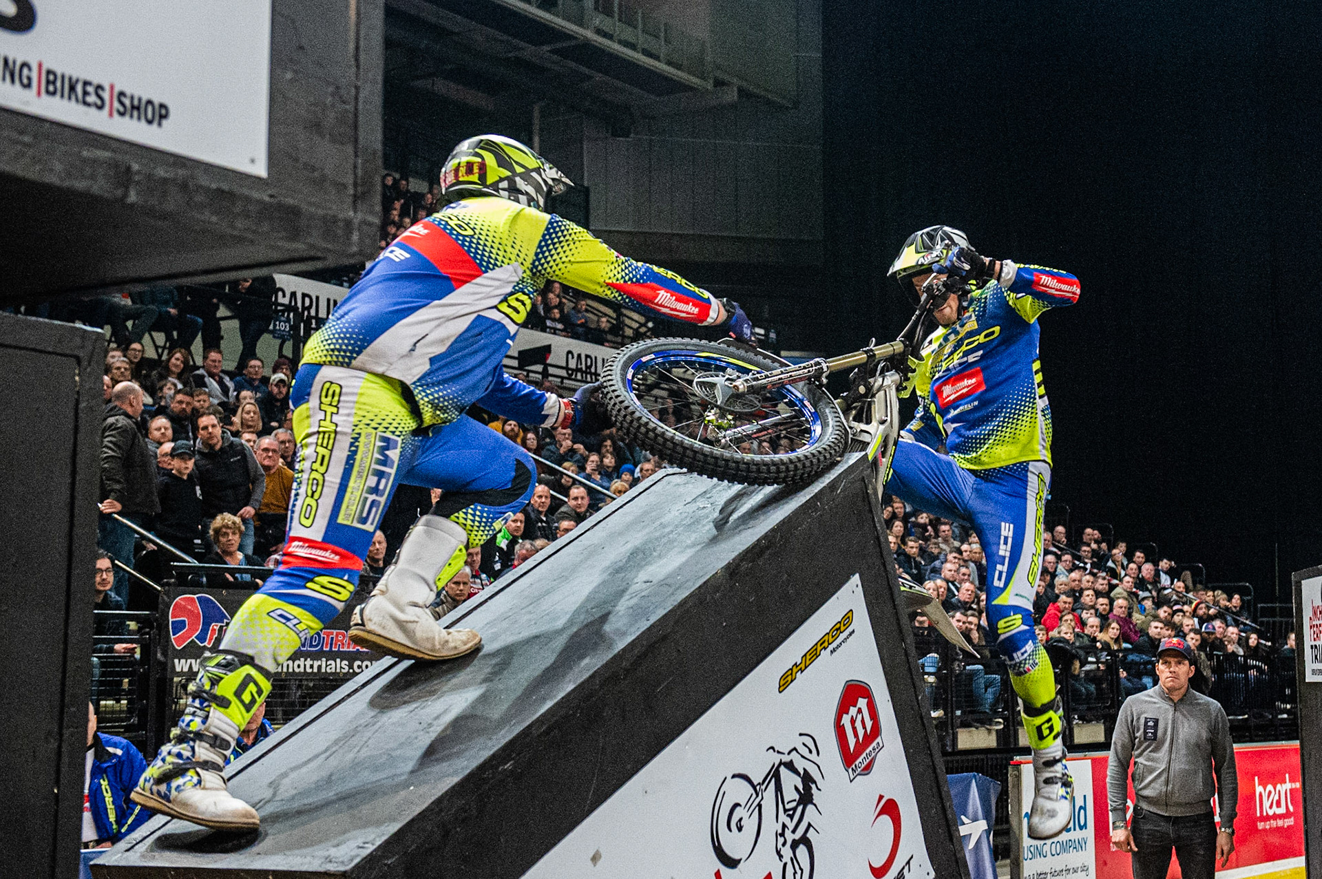 SHEFFIELD, ENGLAND  - DECEMBER 28TH  Jack Peace, UK (Sherco) falls on the Boxes, as his minder grabs the wheel  during the 25th Anniversary Sheffield Indoor Trial at the FlyDSA Arena, Sheffield on Saturday 28th December 2019. (Credit: Ian Charles | MI News)