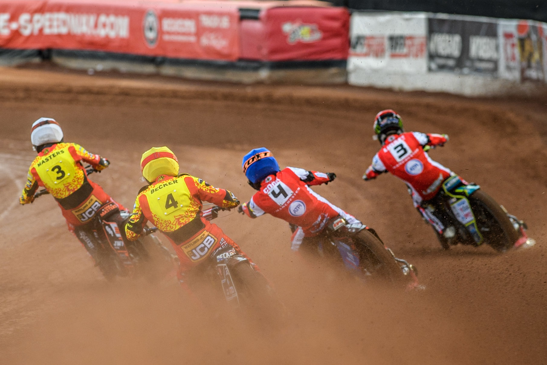 Leicester Lions' Luke Becker in Yellow chases Belle Vue Aces' Ben Cook in Blue, Belle Vue Aces' Jaimon Lidsey in Red and Leicester Lions' Sam Masters in White during the Rowe Motor Oil Premiership match between Belle Vue Aces and Leicester Lions at the National Speedway Stadium, Manchester on Monday 24th June 2024. (Photo: Ian Charles | MI News)