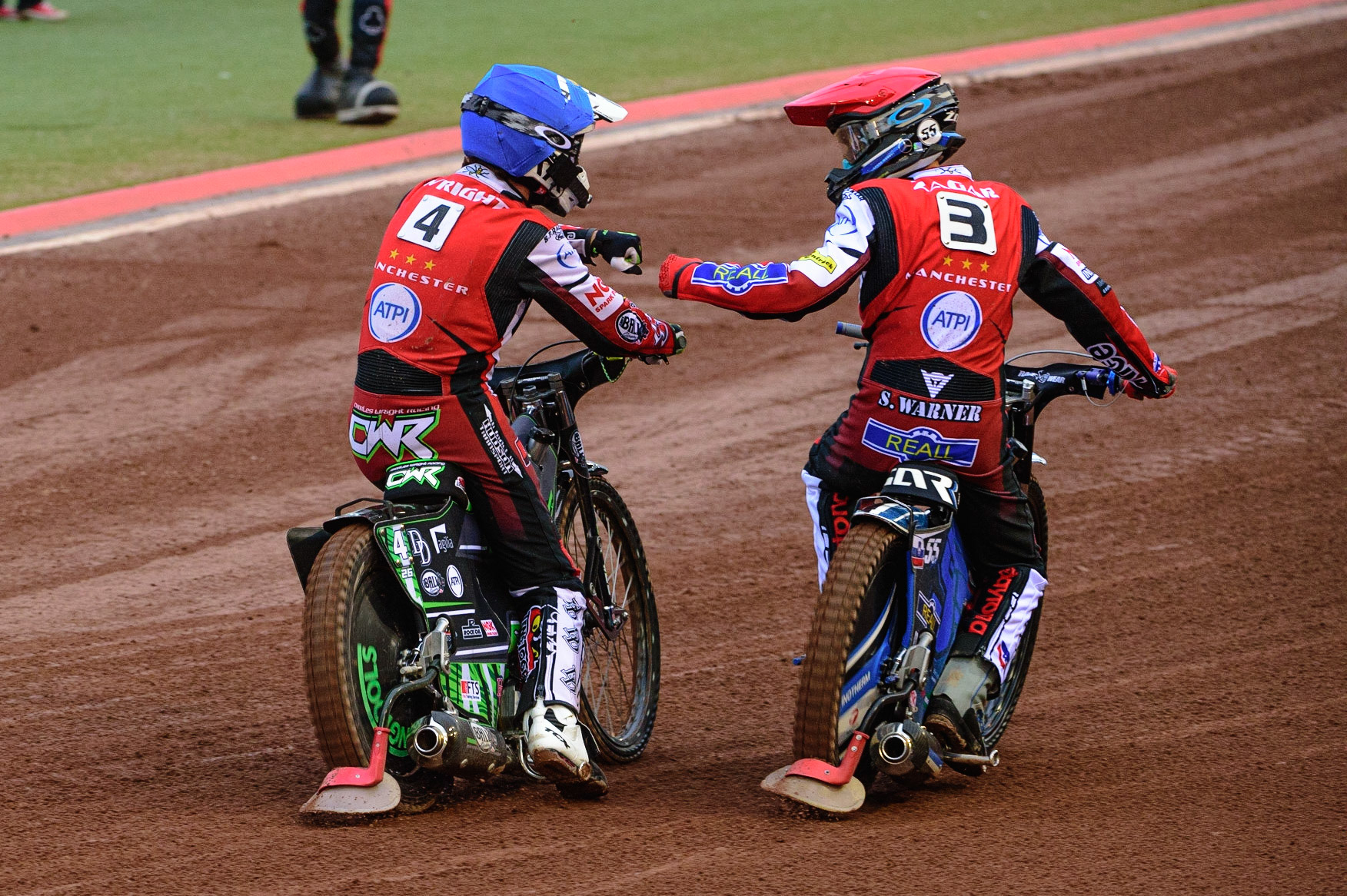 MANCHESTER, UK. JUN 6TH Charles Wright  (Blue) and Matej Žagar  (Red) celebrate their heat win  during the SGB Premiership match between Belle Vue Aces and Ipswich Witches at the National Speedway Stadium, Manchester on Monday 6th June 2022. (Credit: Ian Charles | MI News)