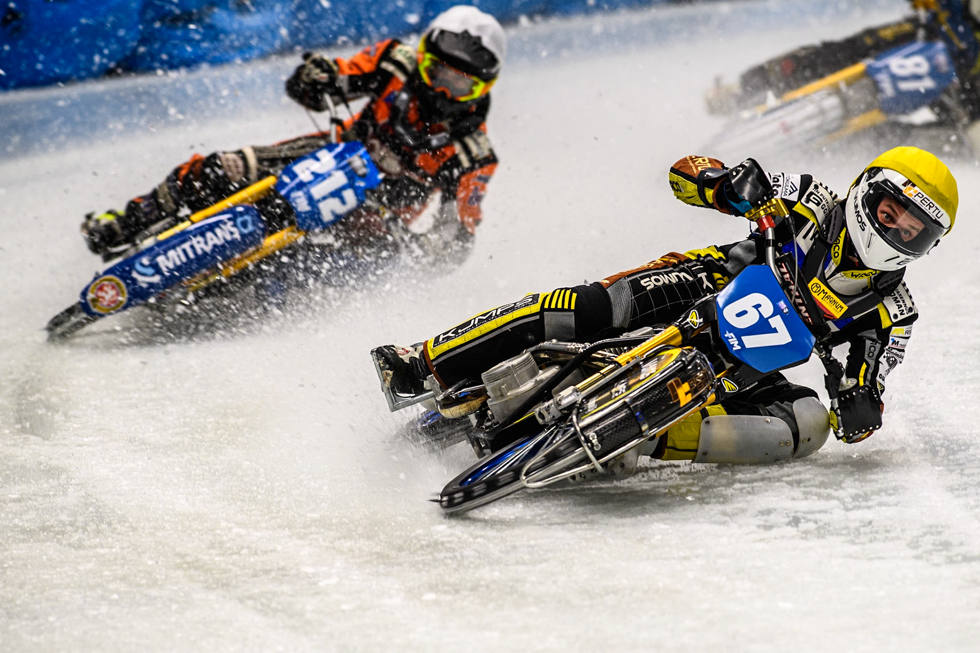 Heikki Huusko (67) of Finland in Yellow leading Lukas Hutla (212) of the Czech Republic in White during the Ice Speedway Gladiators World Championship Final 1 at Max-Aicher-Arena, Inzell on Saturday 15th March 2025. (Photo: Ian Charles | MI News)