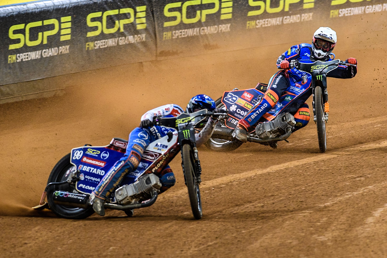 Semi Final 2: Daniel Bewley (99) of Great Britain in Blue leading Andzejs Lebedevs (29) of Latvia in White during the FIM Speedway Grand Prix of Great Britain at The Principality Stadium, Cardiff on Saturday 17th August 2024. (Photo: Ian Charles | MI News)