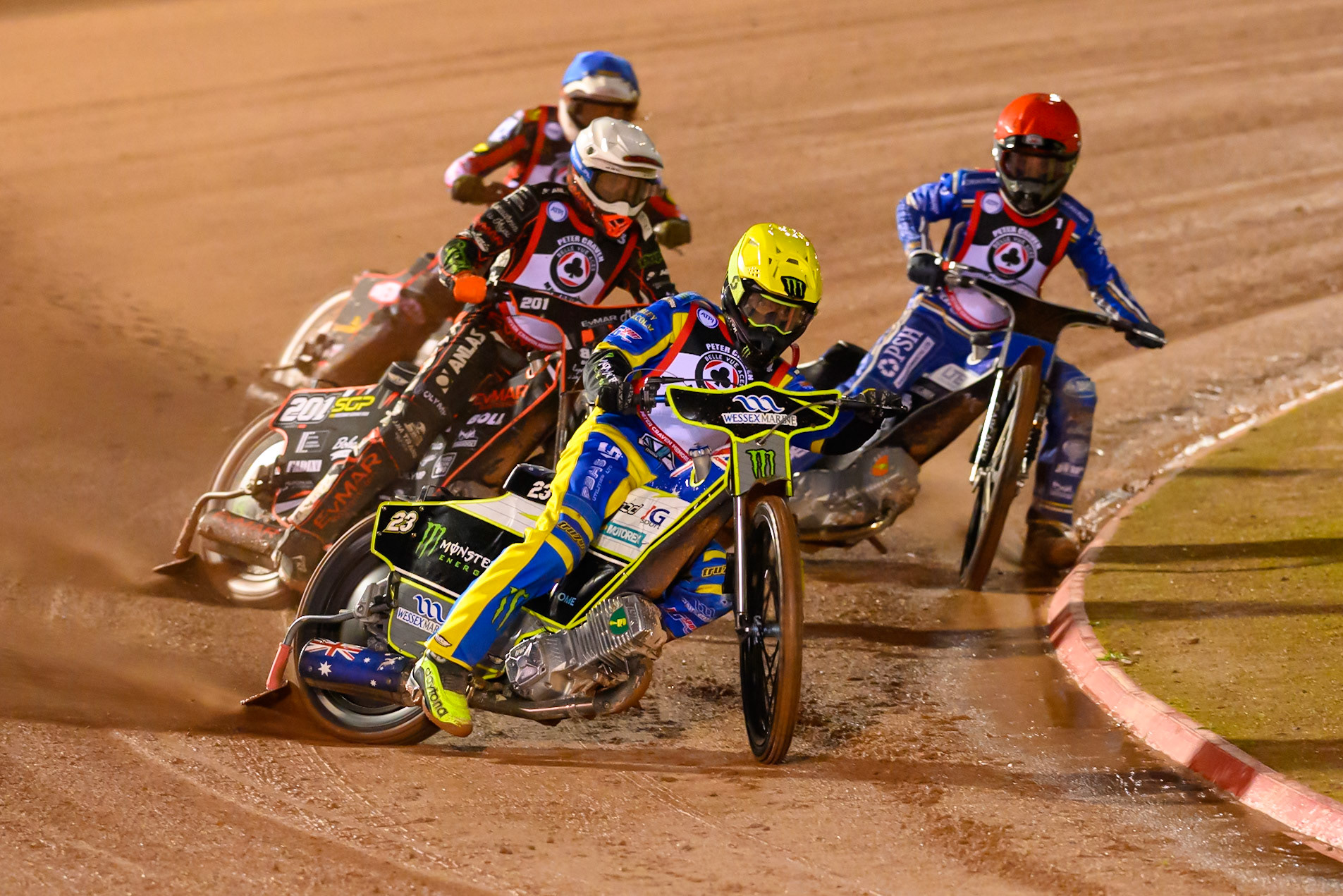 Chris Holder in Yellow leading Jan Kvech in White, Nicolai Klindt in Red and Peter Kildemand in Blue  during the Peter Craven Memorial Trophy at the National Speedway Stadium, Manchester, on Monday 16th March 2026. (Photo: Ian Charles | MI News)