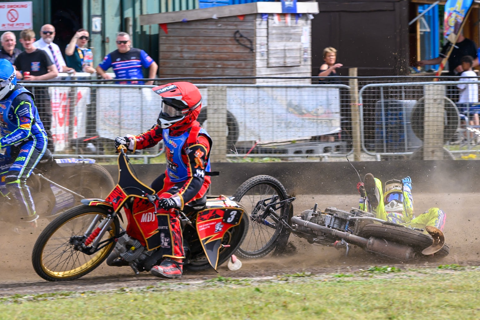 In the re-run of Heat 5, Darryl Ritchings of Oxford Chargers  falls behind Luke Harris of Buxton Bulls in Red  during the WSRA National Development League match between Buxton Bulls and Oxford Chargers at Hi-Edge Speedway, Buxton on Sunday 2nd August 2026. (Photo: Ian Charles | MI News)