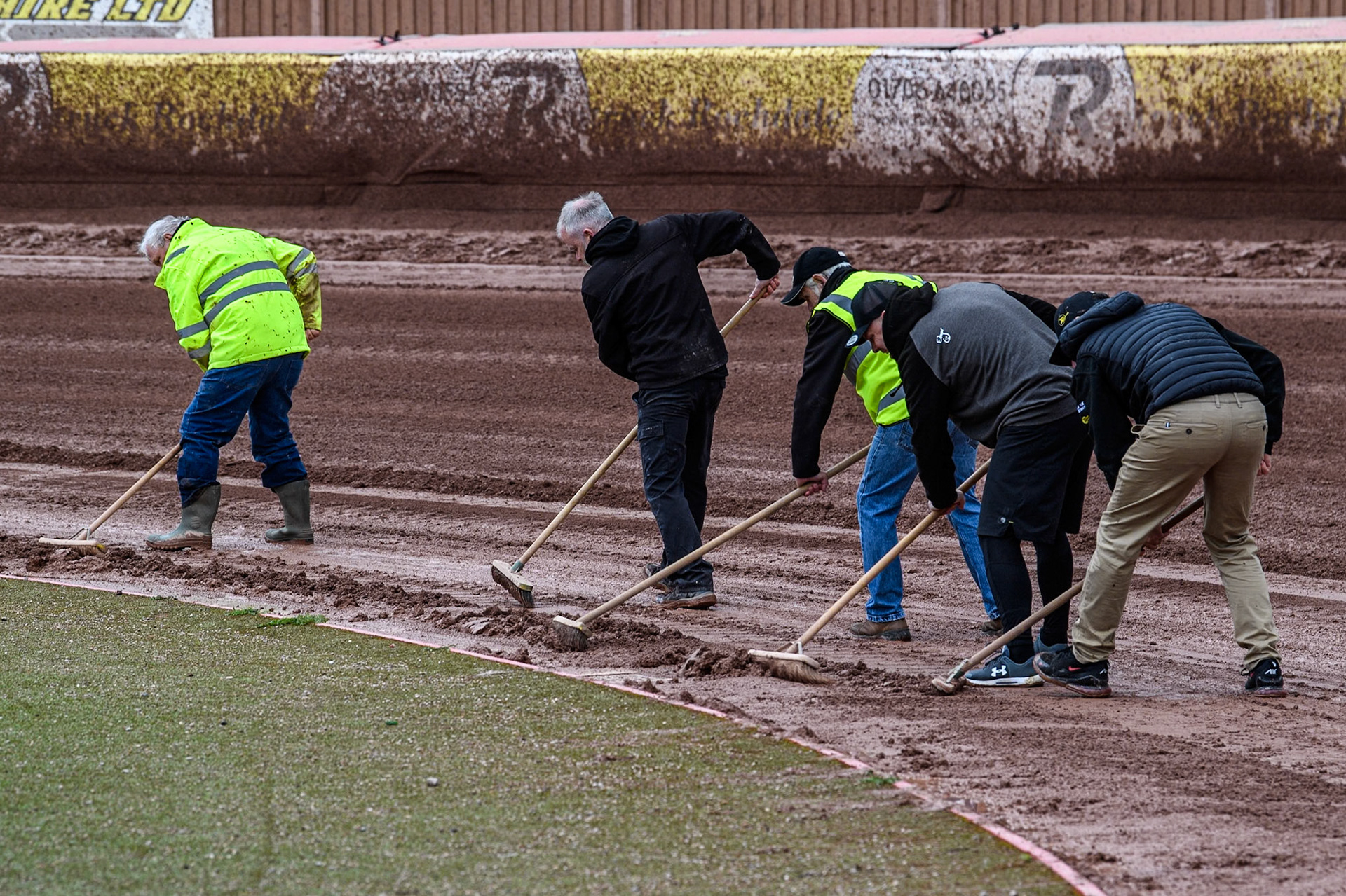 Track staff try to clear the damp shale during the track prep during the Rowe Motor Oil Premiership match between Belle Vue Aces and Sheffield Tigers at the National Speedway Stadium, Manchester on Monday 27th May 2024. (Photo: Ian Charles | MI News)