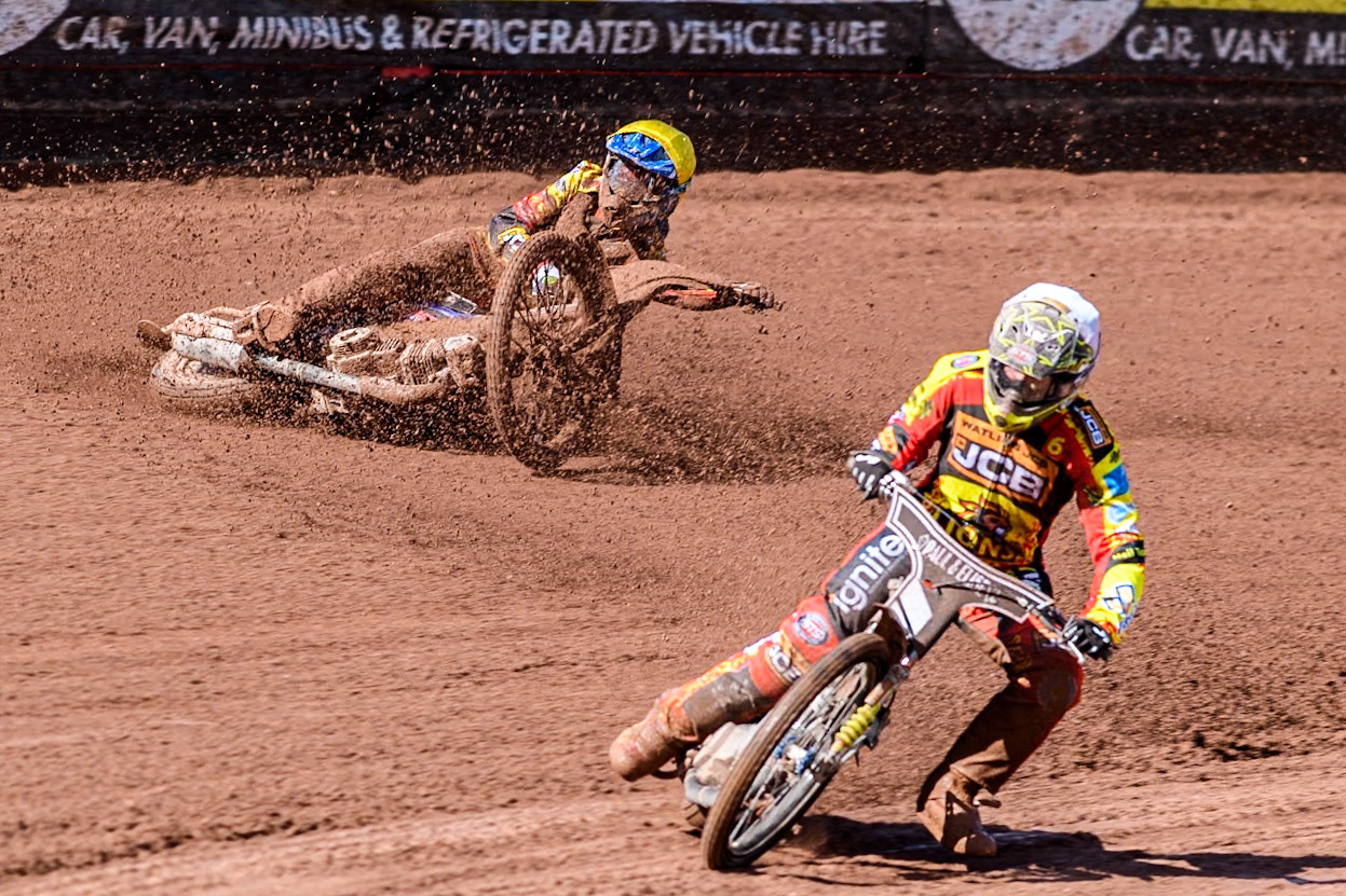 Leicester Lion Cubs' Sonny Springer  (Yellow) falls behind team mate Leicester Lion Cubs' Luke Crang (White) during the WSRA  National Development League match between Belle Vue Colts and Leicester Lion Cubs at the National Speedway Stadium, Manchester on Friday 29th March 2024. (Photo: Ian Charles | MI News)