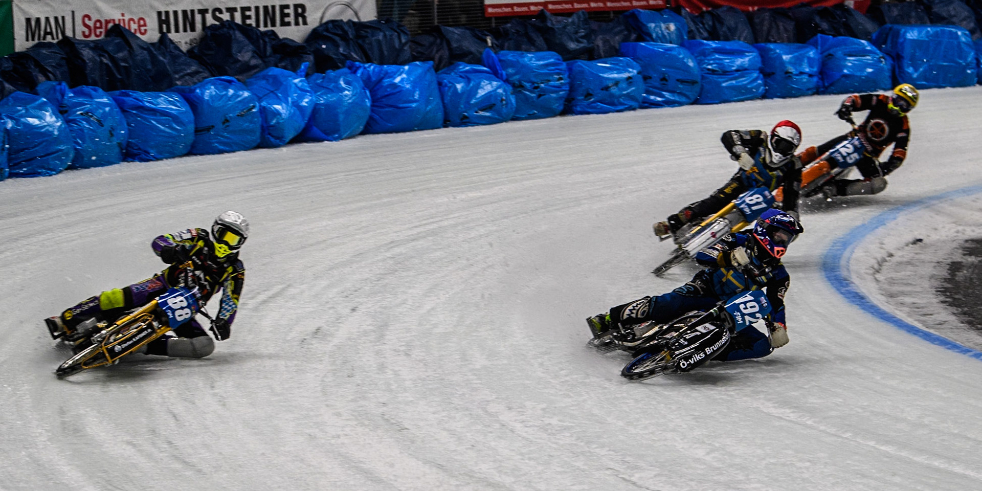 Niclas Svensson (192) of Sweden in Blue rides inside Max Niedermaier  (88) of Germany in White with Jimmy Olsén (81) of Sweden in Red and Sebastian Reitsma (125) of The Netherlands in Yellow behind during the Ice Speedway Gladiators World Championship Final 1 at Max-Aicher-Arena, Inzell on Saturday 15th March 2025. (Photo: Ian Charles | MI News)