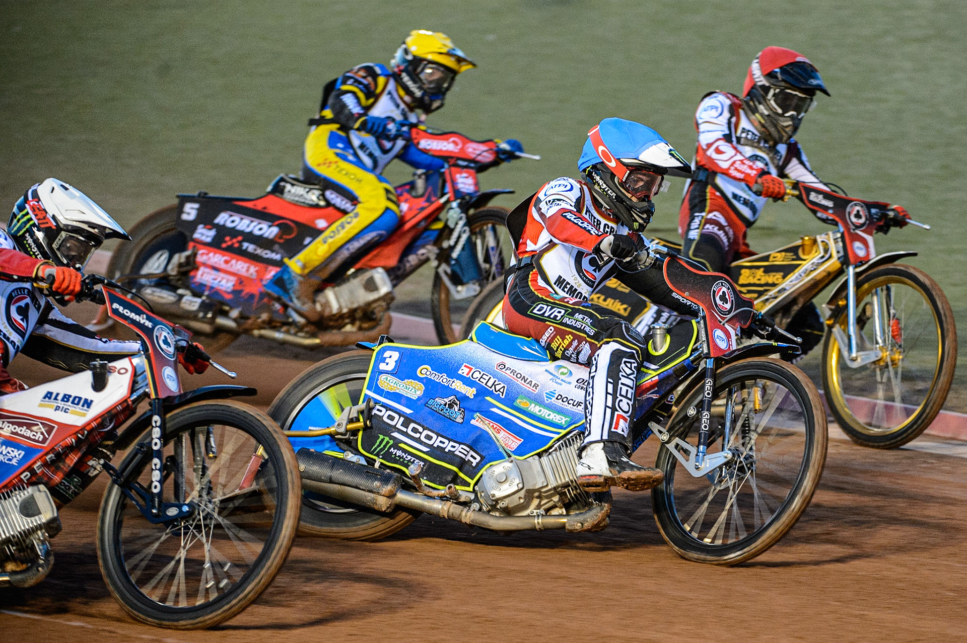 Jaimon Lidsey  (Blue) outside Norick Blodorn  (Red) with Dan Bewley  (White) coming around and Tobiasz Musielak  (Yellow) behind during the Peter Craven Memorial Trophy  at the National Speedway Stadium, Manchester on Monday 3rd April 2023. (Photo: Ian Charles | MI News)