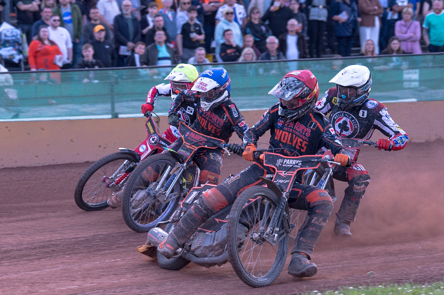WOLVERHAMPTON, UK. JUN 20TH Sam Masters  (Red) leads Nick Morris  (Blue) Matej Zagar   (White) and Max Fricke  (Yellow) into the first corner during the SGB Premiership match between Wolverhampton Wolves and Belle Vue Aces at Monmore Green Stadium, Wolverhampton on Monday 20th June 2022. (Credit: Ian Charles | MI News)