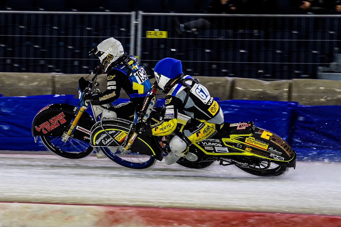 Finland's Heikki Huusko (67) in Blue rides inside Sweden's Martin Haarahiltunen (199)  in White during the FIM Ice Speedway Gladiators World Championship Final 4 at Ice Rink Thialf, Heerenveen on Sunday 7th April 2024. (Photo: Ian Charles | MI News)