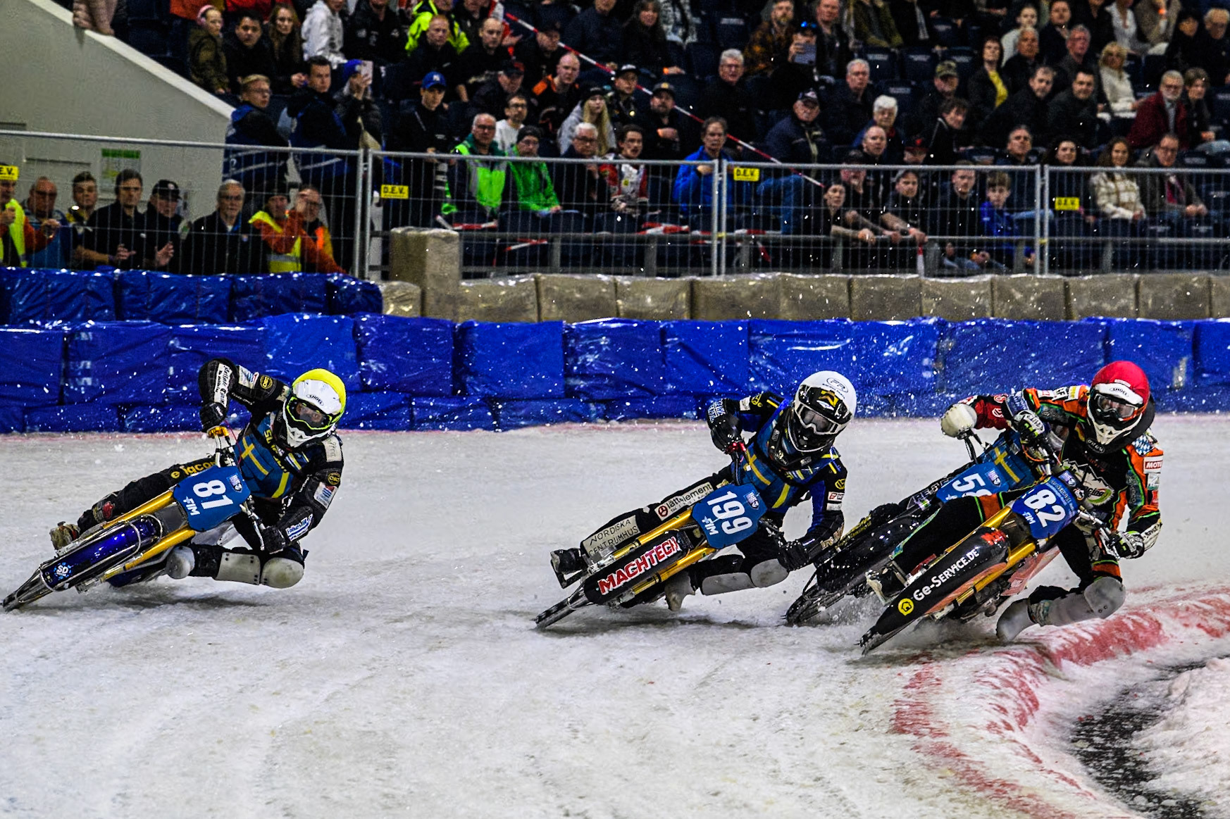 Germany's Markus Jell (82) in Red rides inside Sweden's Martin Haarahiltunen (199)  in White Sweden"s Jimmy Olsén (81) in Yellow with Sweden's Stefan Svensson (58) in Blue behind during the FIM Ice Speedway Gladiators World Championship Final 3 at Ice Rink Thialf, Heerenveen on Saturday 6th April 2024. (Photo: Ian Charles | MI News)