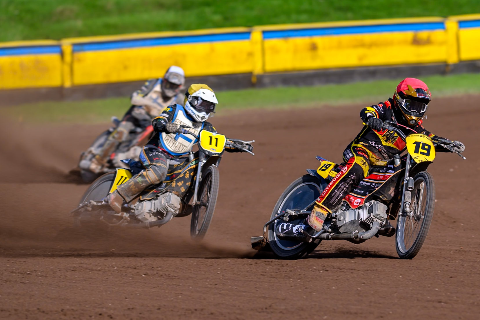 Lukas Fienhage (19) of Germany in Red leading Jesse Mustonen (11) of Finland in Yellow  and Ossi Rantala (12) of Finland in Black &amp; White  during the FIM Long Track of Nations 2026 at the Speed Centre Roden in the Netherlands on Sunday 20th September 2026. (Photo: Ian Charles | MI News)