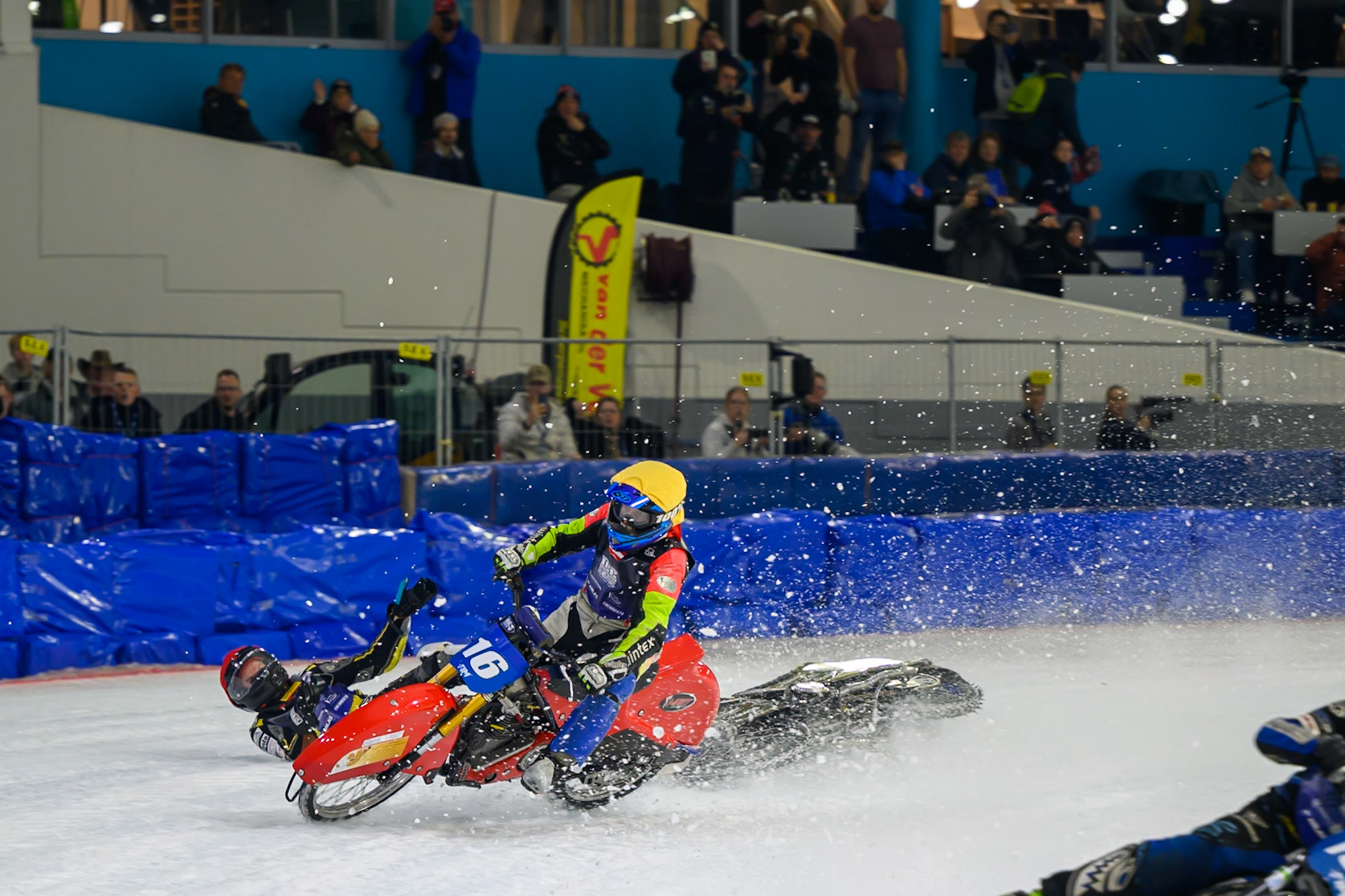 Heikki Huusko (67) of Finland  collides with Wild Card Harald Simon (16) of Austria in Yellow in the first turn during the FIM Ice Speedway Gladiators World Championship Final 3 at Ice Rink Thialf, Heerenveen on Saturday 11th April 2026. (Photo: Ian Charles | MI News)