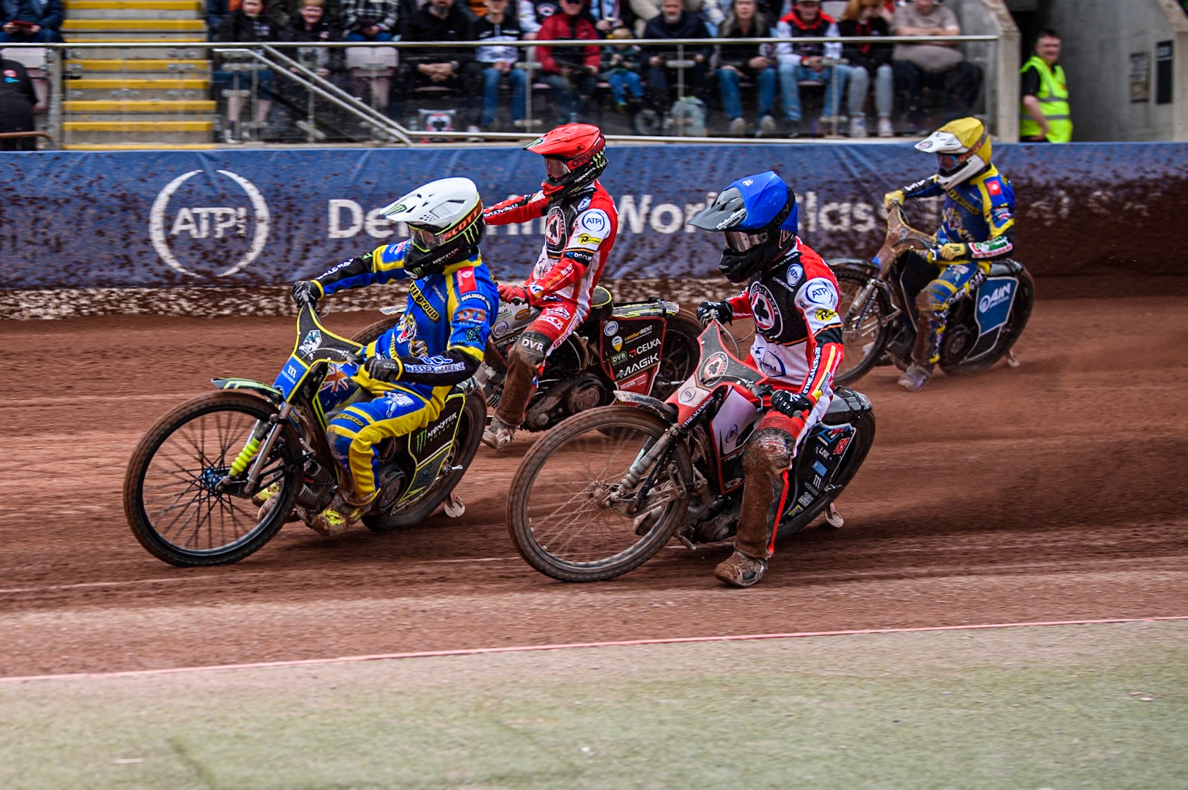 Chris Holder of Sheffield Tigers in White leading Zach Cook of Belle Vue Aces in Blue, Jaimon Lidsey of Belle Vue Aces in Red and Lewis Kerr of Sheffield Tigers in Yellow during the Rowe Motor Oil Premiership match between Belle Vue Aces and Sheffield Tigers at the National Speedway Stadium, Manchester on Monday 5th May 2025. (Photo: Ian Charles | MI News)