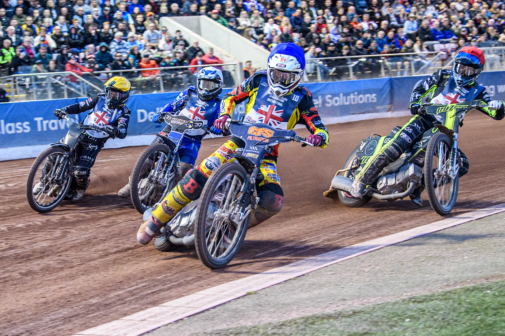 The Semi Final: Steve Worrall in Blue leading Adam Ellis in Red, Chris Harris in White and Tai Woffinden in Yellow during the Attis Insurance Sports Division British Speedway Championship Final at the National Speedway Stadium, Manchester on Saturday 8th June 2024. (Photo: Ian Charles | MI News)