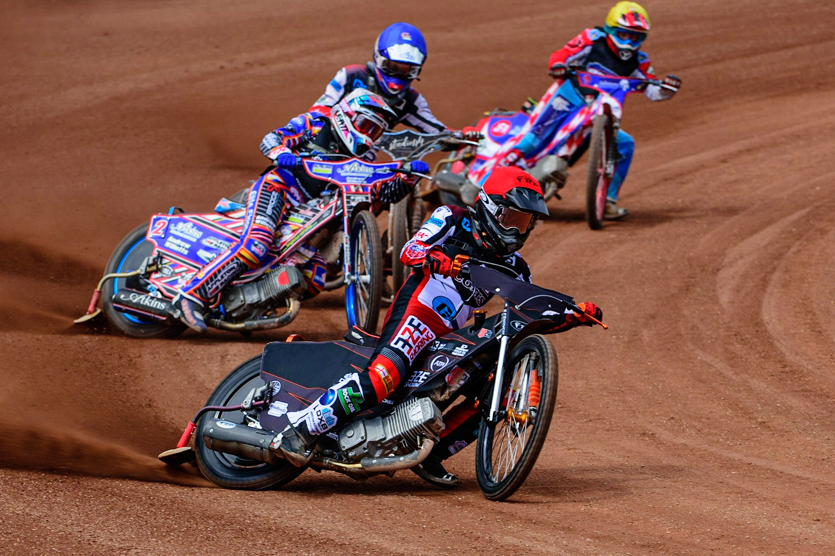 MANCHESTER, UK.  JUN 3RD Jack Smith  (Red) leads Henry Atkins  (White) Freddy Hodder  (Blue) and Jacob Fellows  (Yellow)  during the National Development League match between Belle Vue Colts and Oxford Chargers at the National Speedway Stadium, Manchester on Friday 3rd June 2022. (Credit: Ian Charles | MI News)