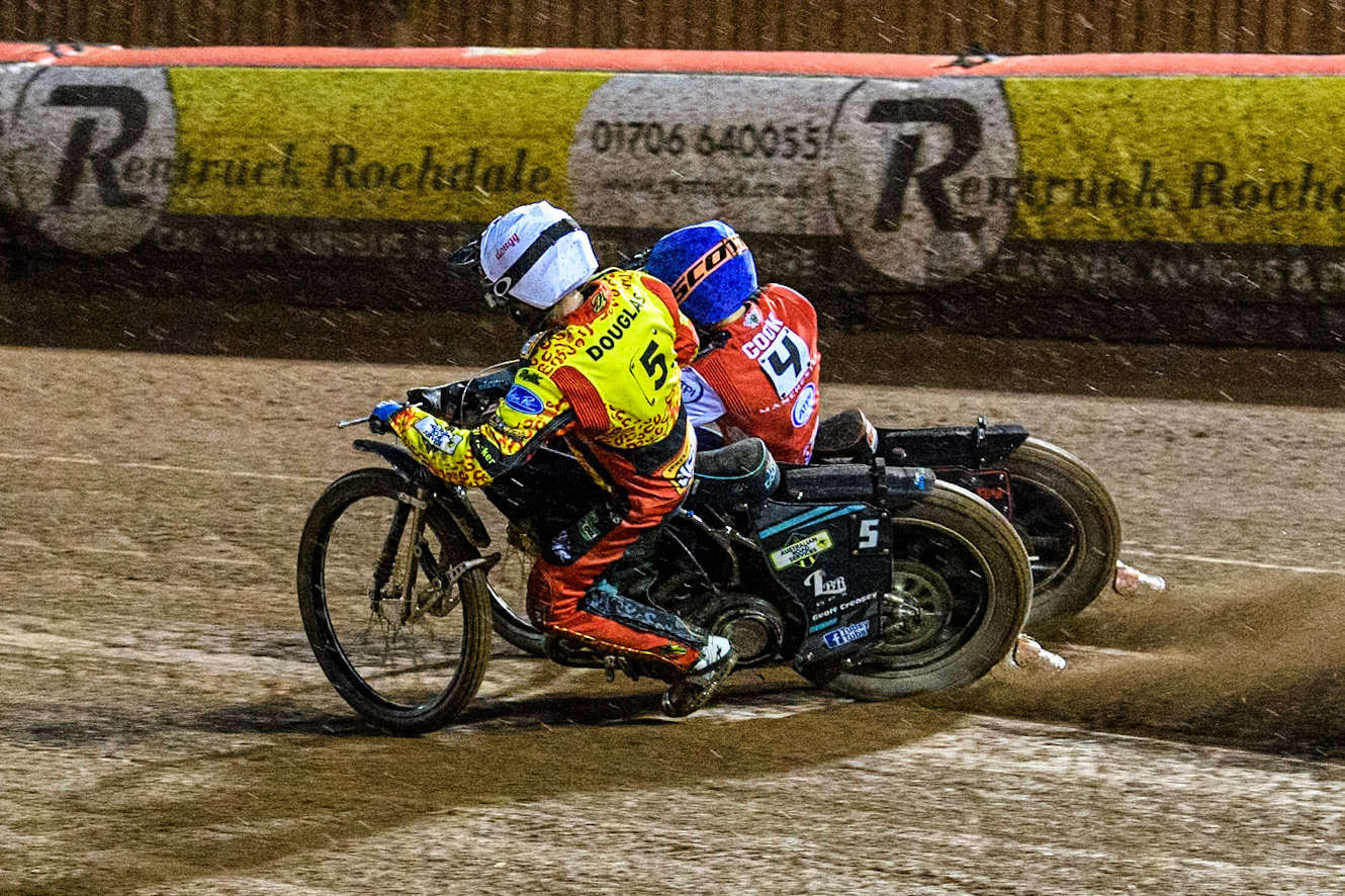 Ryan Douglas of Leicester Lions in White rides inside Ben Cook of Belle Vue Aces in Blue during the Rowe Motor Oil Premiership match between Belle Vue Aces and Leicester Lions at the National Speedway Stadium, Manchester on Saturday 6th April 2024. (Photo: Ian Charles | MI News)